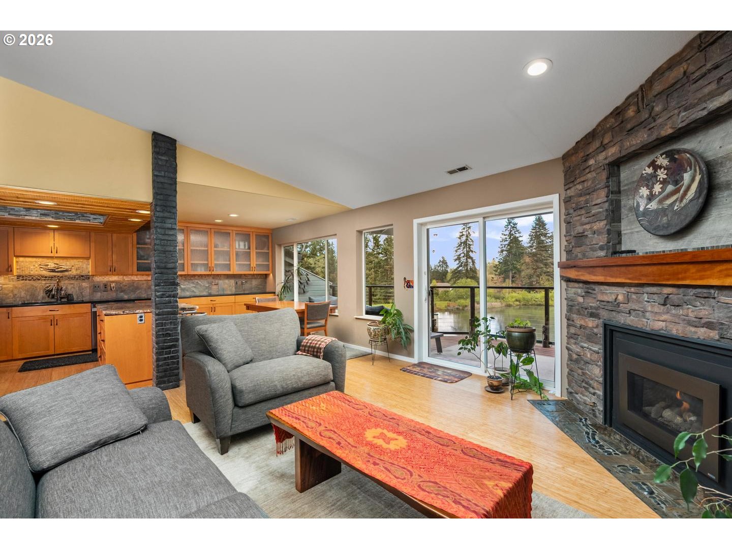 1840 Rees Hill Road Southeast, Unit 19 Salem, OR 97306 - Photo 9 of 34 a living room with furniture a fireplace and a large window