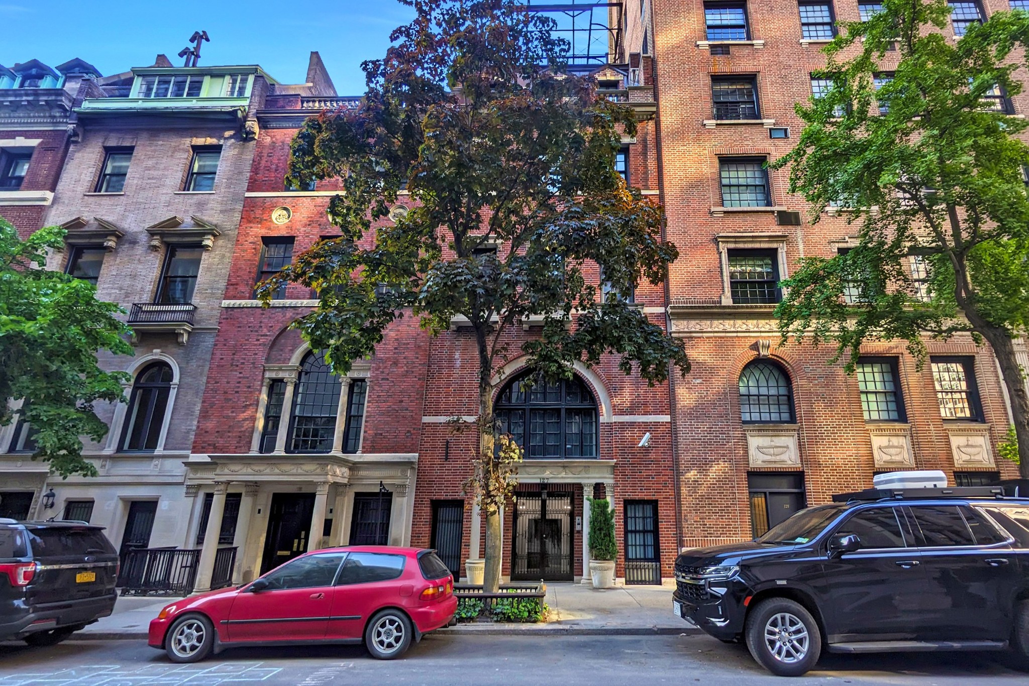 127 East 69th Street, Unit PH Manhattan, NY 10021 - Photo 11 of 11 a car parked in front of a building