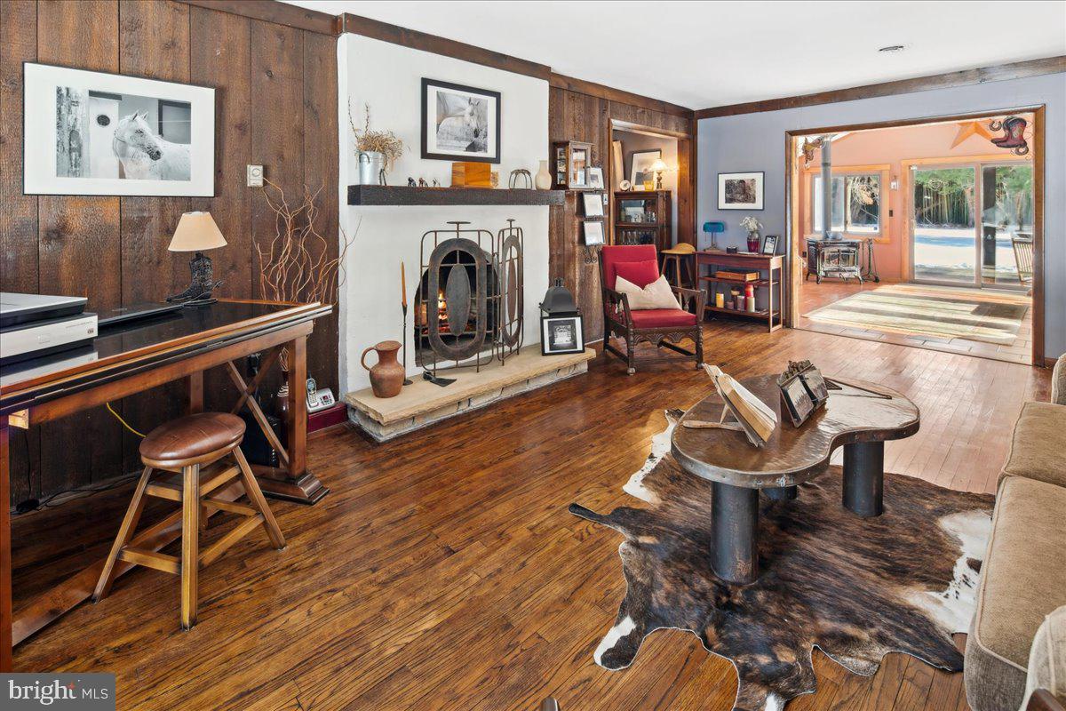2620 Monmouth Road Jobstown, NJ 08041 - Photo 20 of 69 a living room with furniture a fireplace and a large window