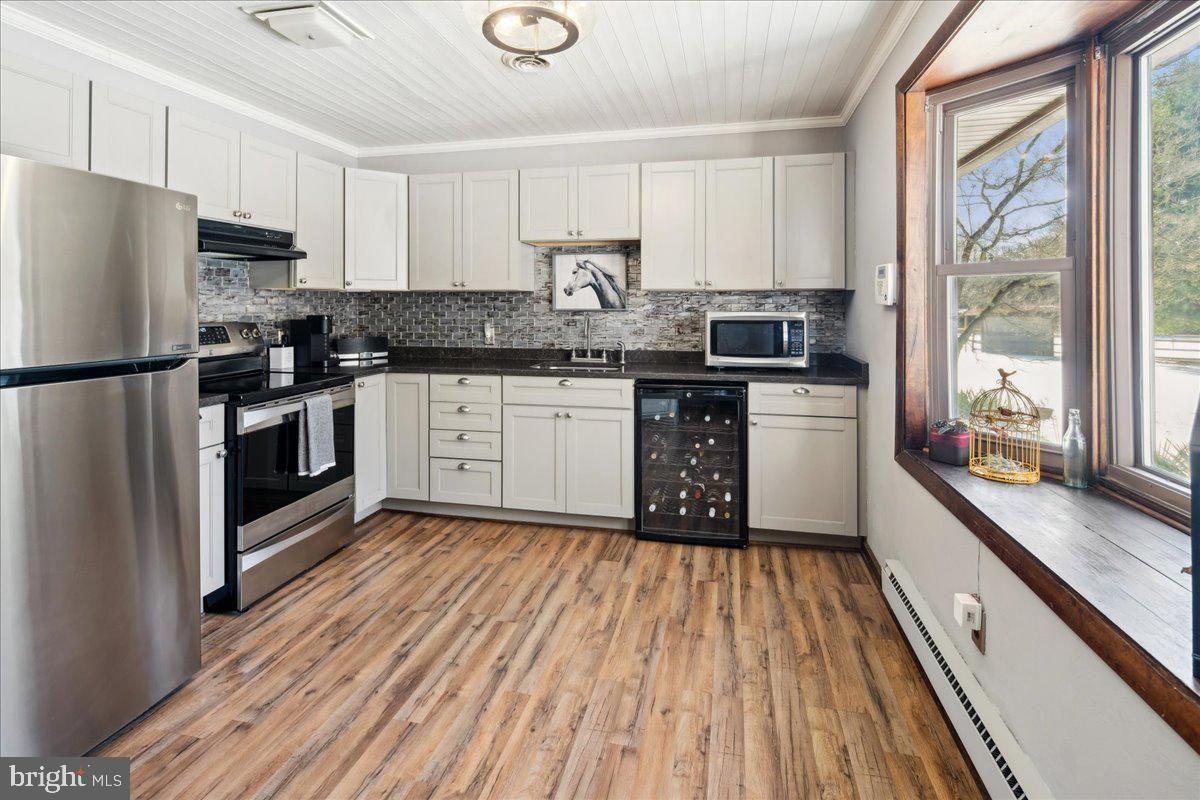 2620 Monmouth Road Jobstown, NJ 08041 - Photo 5 of 69 a kitchen with granite countertop a refrigerator stove top oven and sink