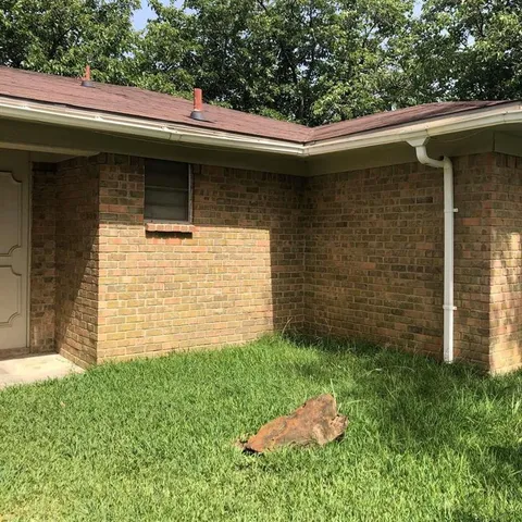 a backyard of a house with lots of green space