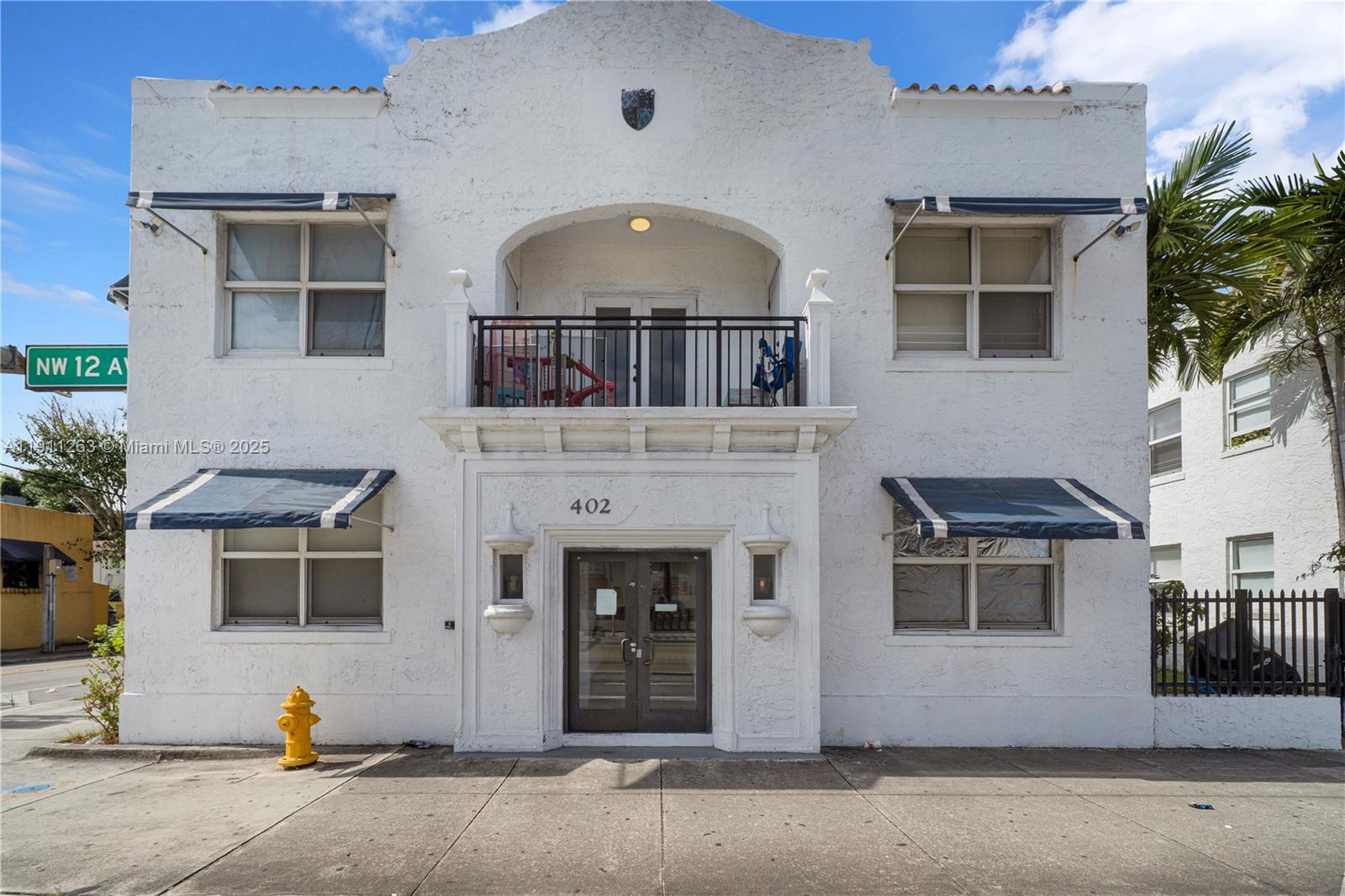 402 Northwest 12th Avenue, Unit 210 Miami, FL 33128 - Photo 14 of 16 a front view of a house with a garage