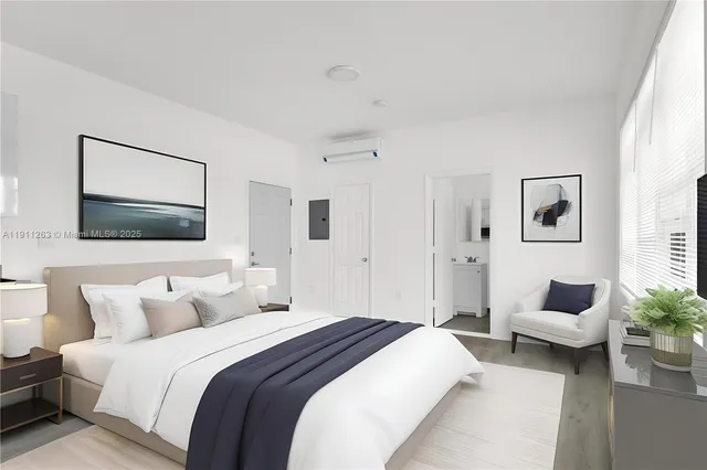 a spacious bedroom with a bed and a couch