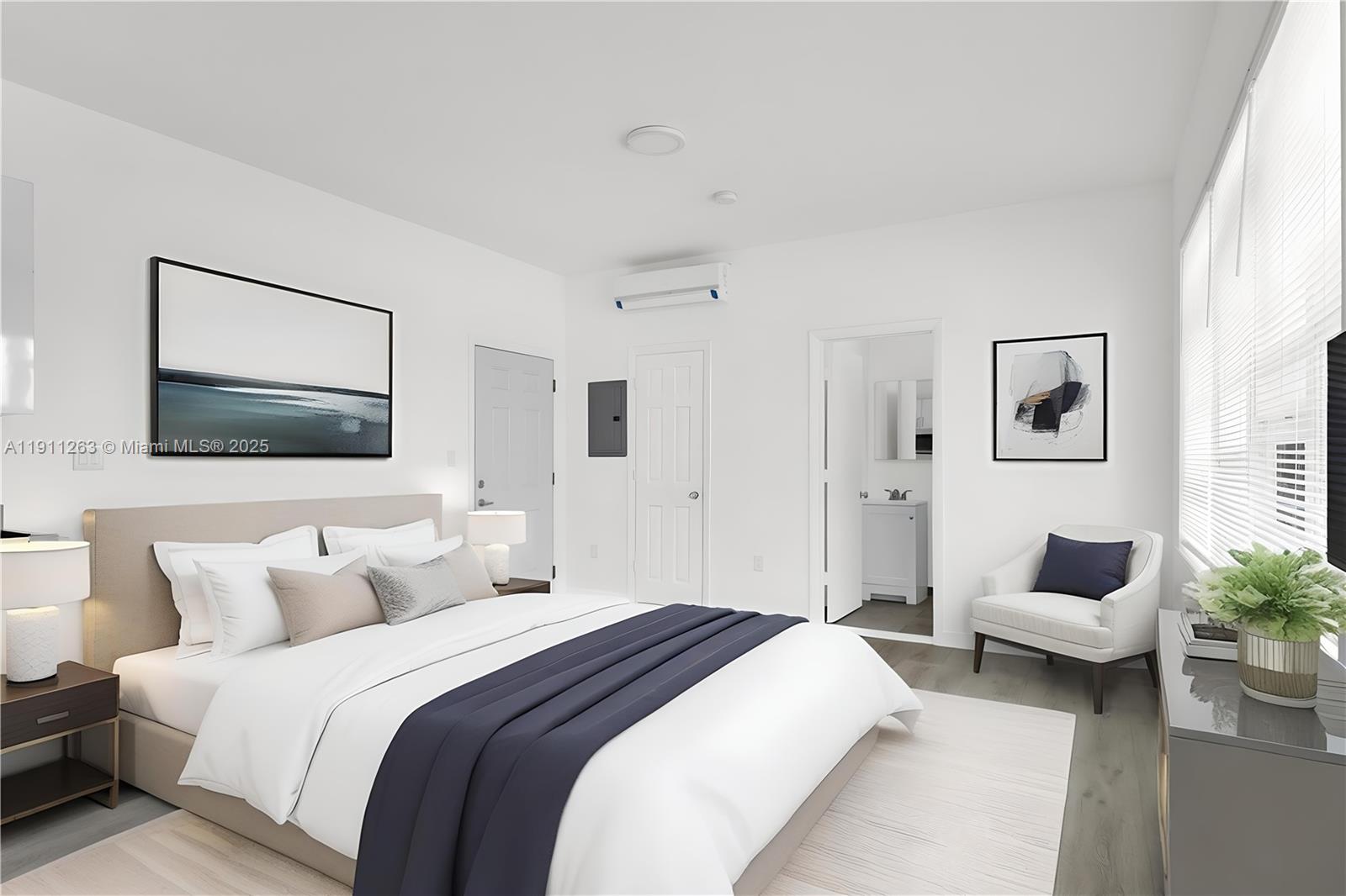 402 Northwest 12th Avenue, Unit 210 Miami, FL 33128 - Photo 5 of 16 a spacious bedroom with a bed and a couch