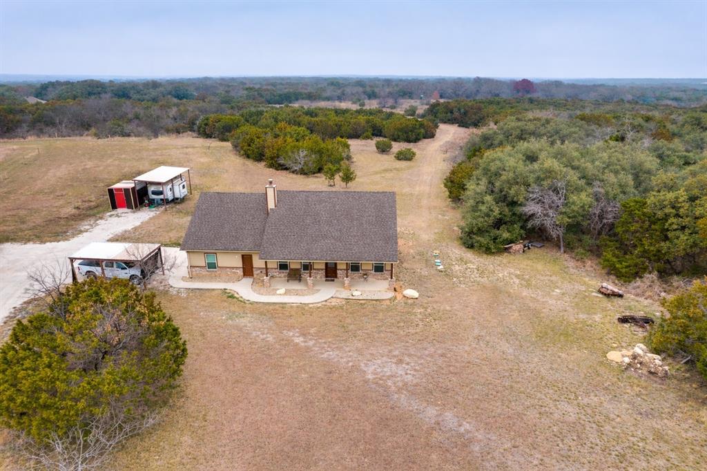 198 Fort Graham Whitney, TX 76692 - Photo 1 of 30 an aerial view of a house with a lake view