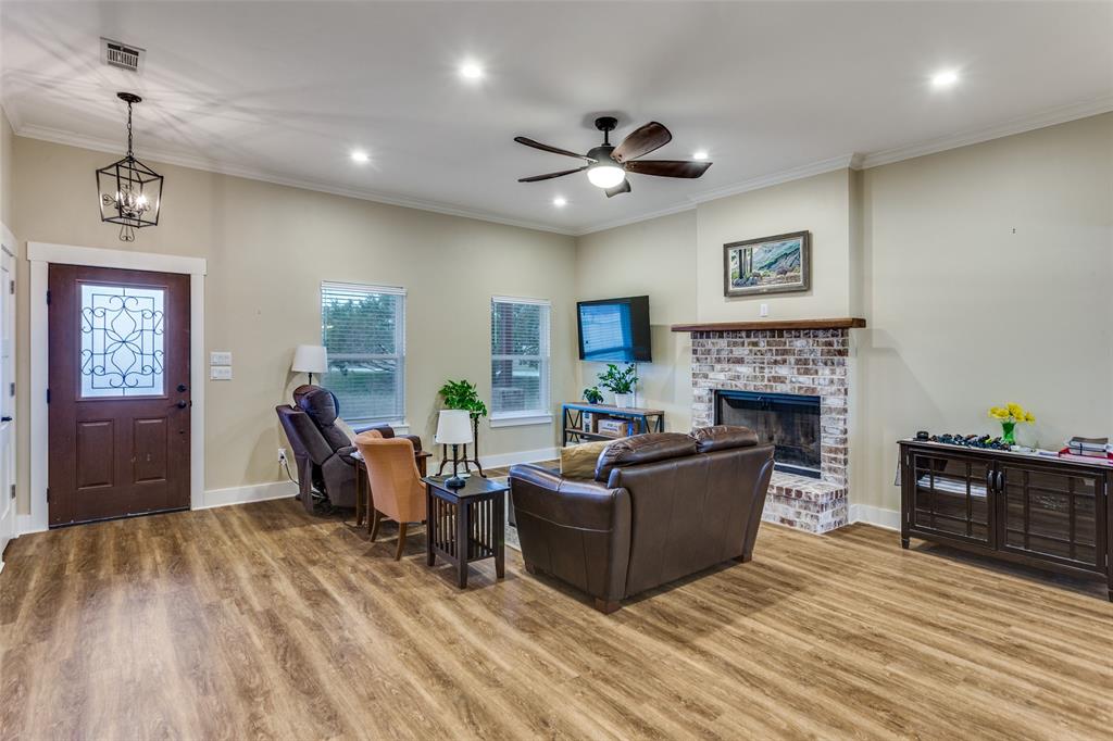 198 Fort Graham Whitney, TX 76692 - Photo 11 of 30 a living room with furniture a fireplace and a window