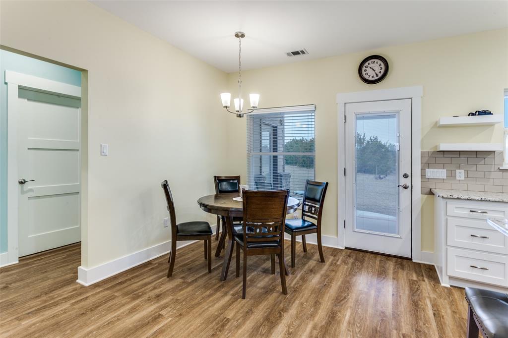 198 Fort Graham Whitney, TX 76692 - Photo 14 of 30 a view of a dining room with furniture and wooden floor