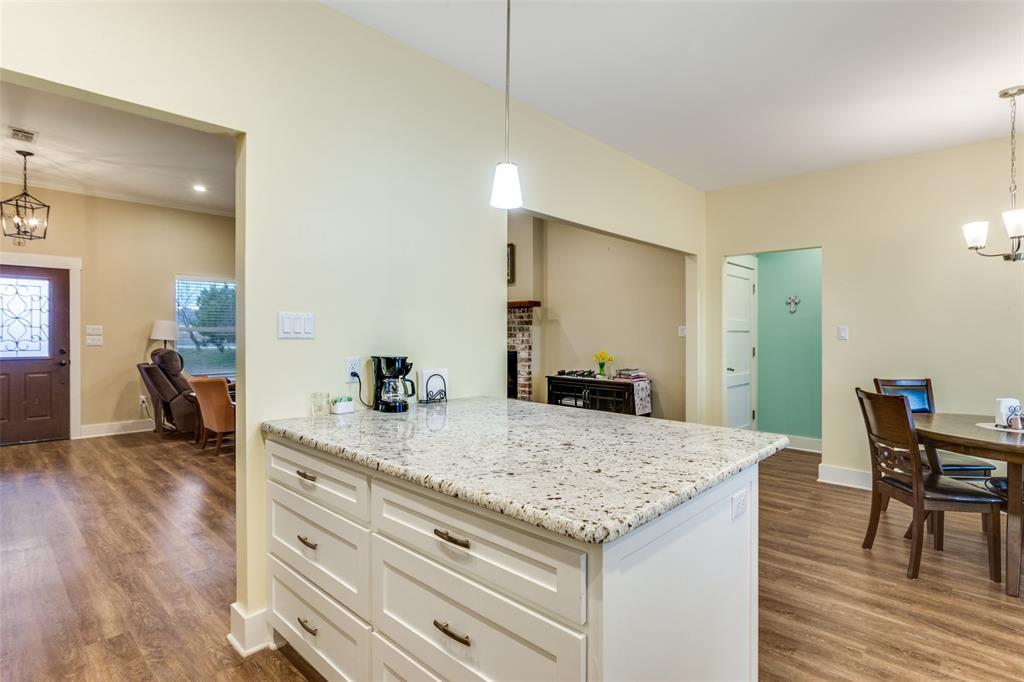 198 Fort Graham Whitney, TX 76692 - Photo 18 of 30 a view of kitchen island and living room