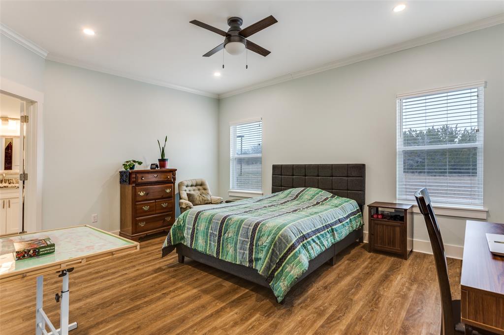 198 Fort Graham Whitney, TX 76692 - Photo 20 of 30 a bedroom with a bed and a table