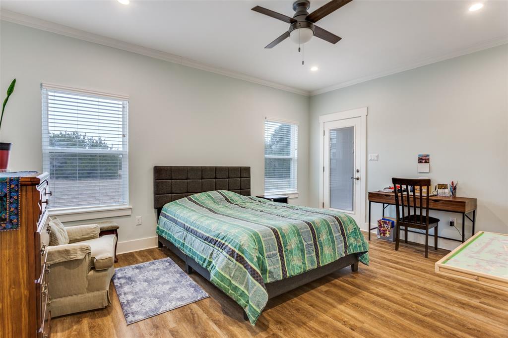 198 Fort Graham Whitney, TX 76692 - Photo 21 of 30 a bedroom with a bed and wooden floor