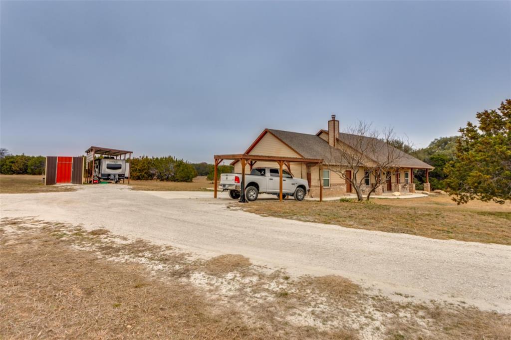 198 Fort Graham Whitney, TX 76692 - Photo 6 of 30 a front view of a house with a road