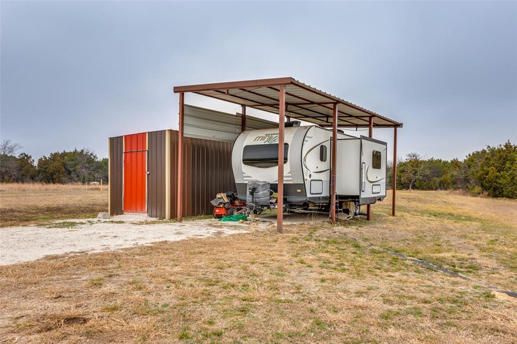 198 Fort Graham Whitney, TX 76692 - Photo 10 of 30 a view of a house with backyard and trees