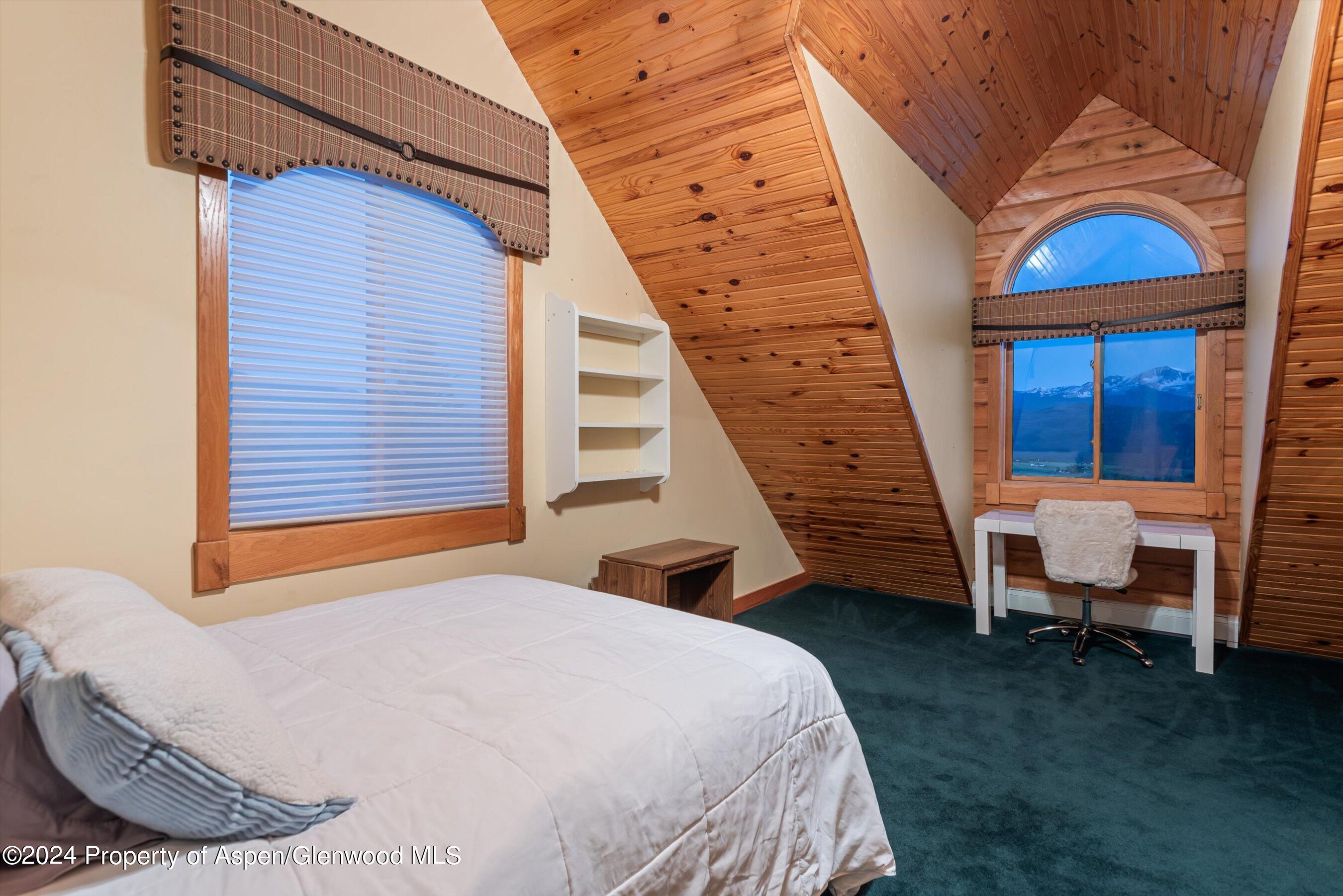 303 Park Meadows Lane Carbondale, CO 81623 - Photo 18 of 47 a view of a bedroom with furniture and staircase