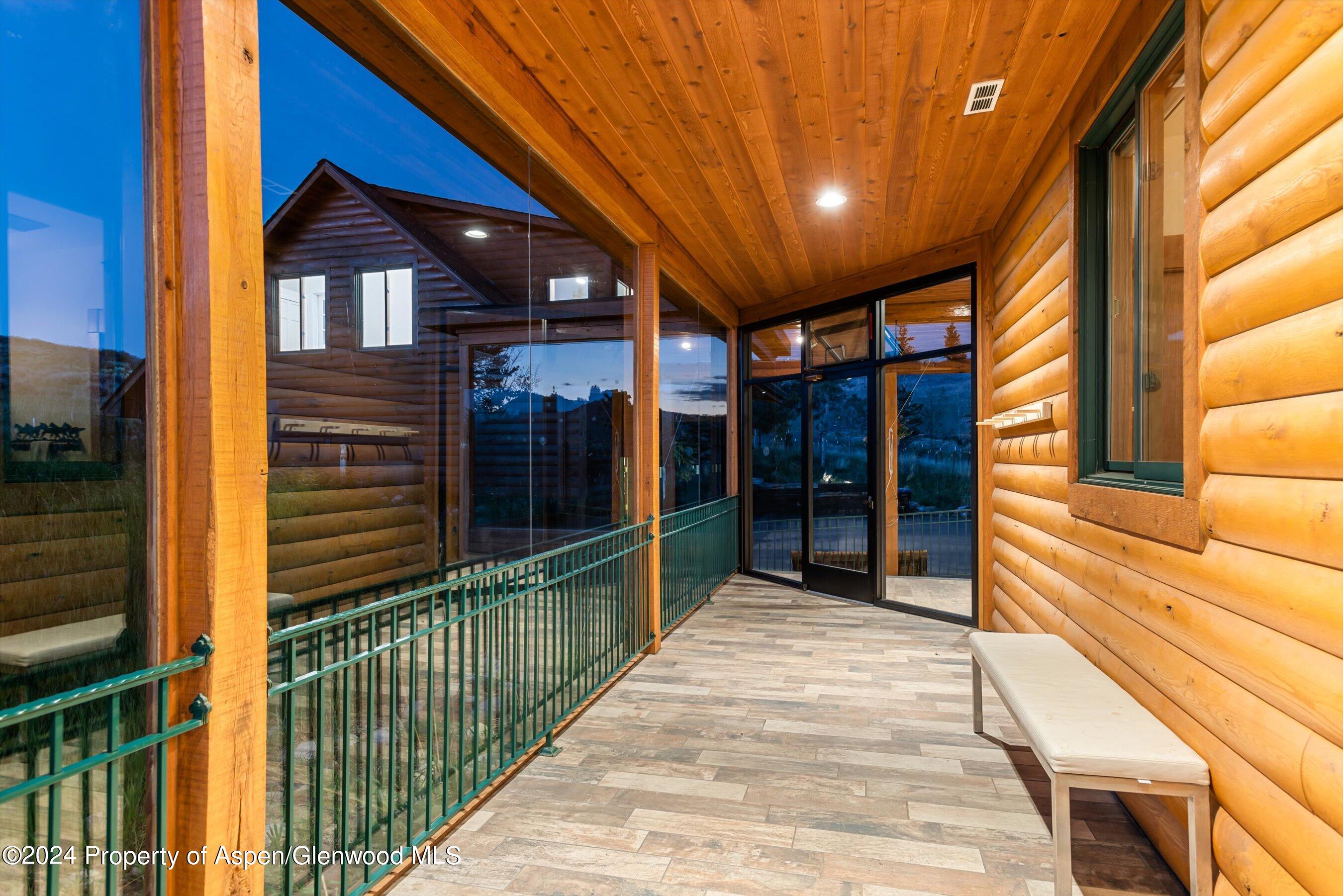 303 Park Meadows Lane Carbondale, CO 81623 - Photo 23 of 47 a view of a porch with a table and chairs
