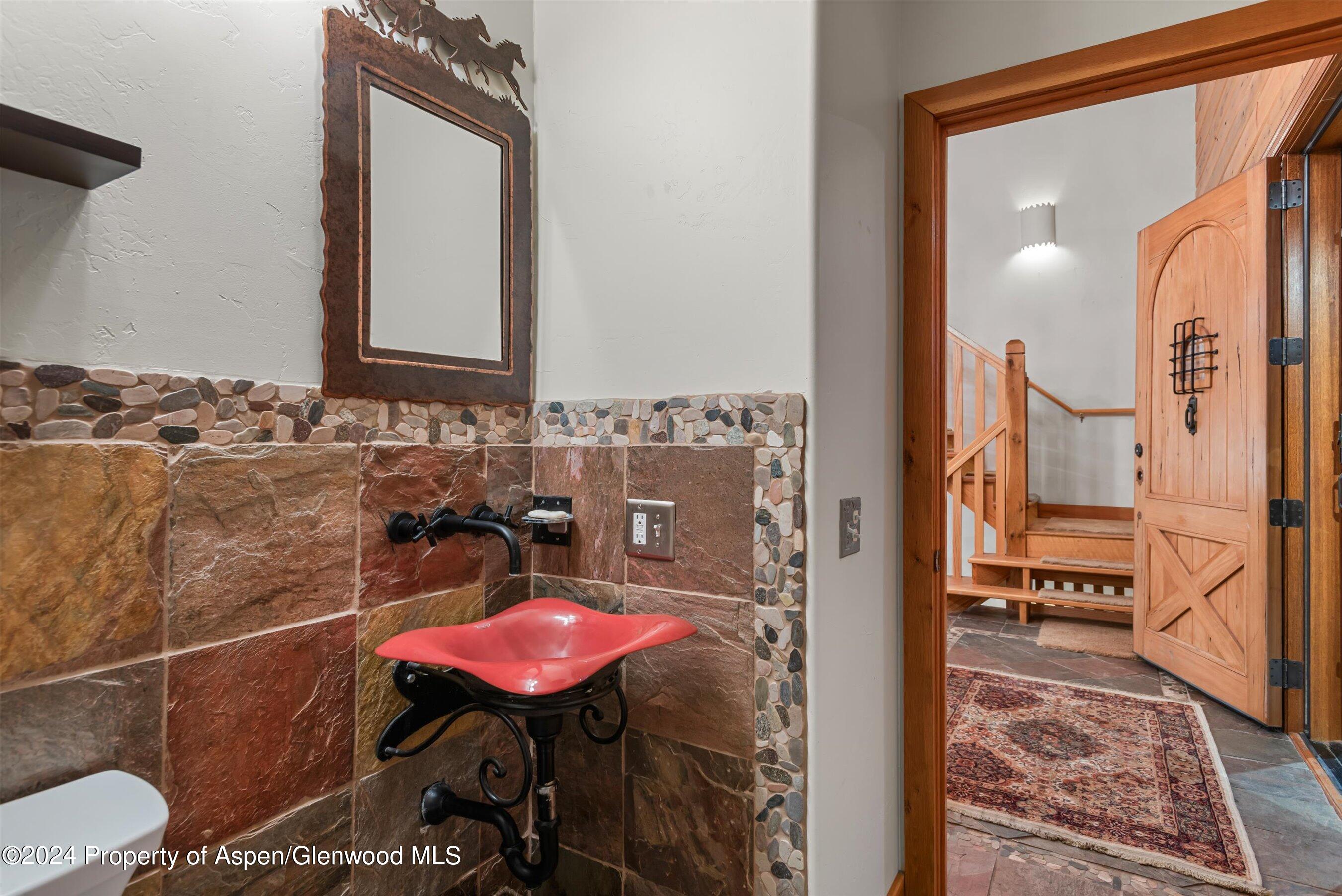 303 Park Meadows Lane Carbondale, CO 81623 - Photo 24 of 47 a bathroom with a sink vanity mirror and toilet