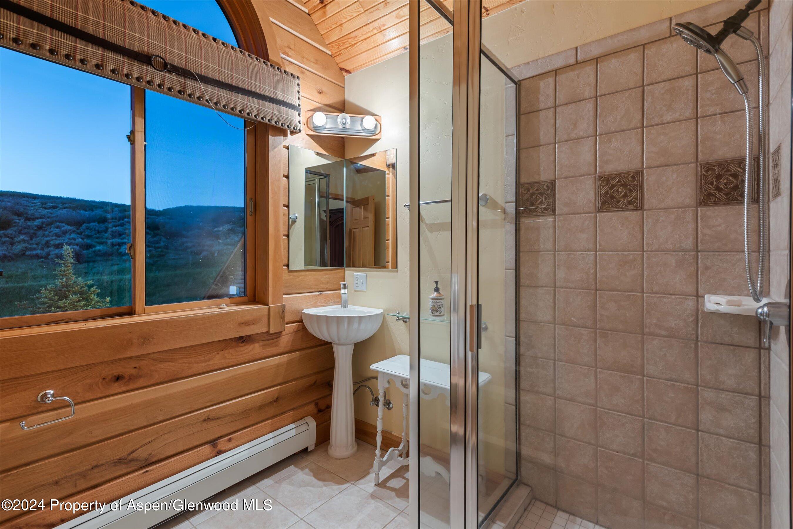 303 Park Meadows Lane Carbondale, CO 81623 - Photo 25 of 47 a bathroom with a sink and mirror