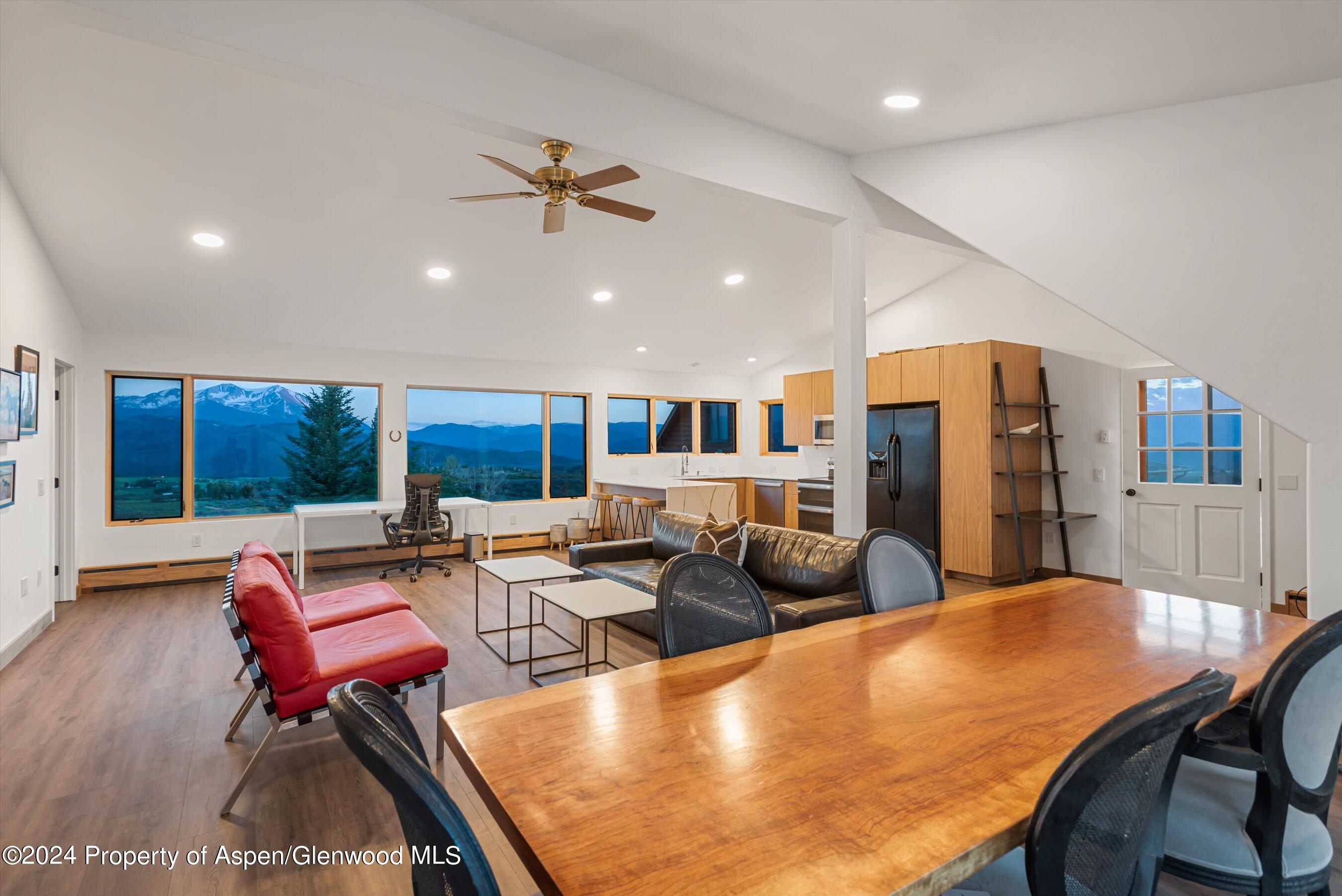 303 Park Meadows Lane Carbondale, CO 81623 - Photo 27 of 47 a living room with furniture pool table and a large window