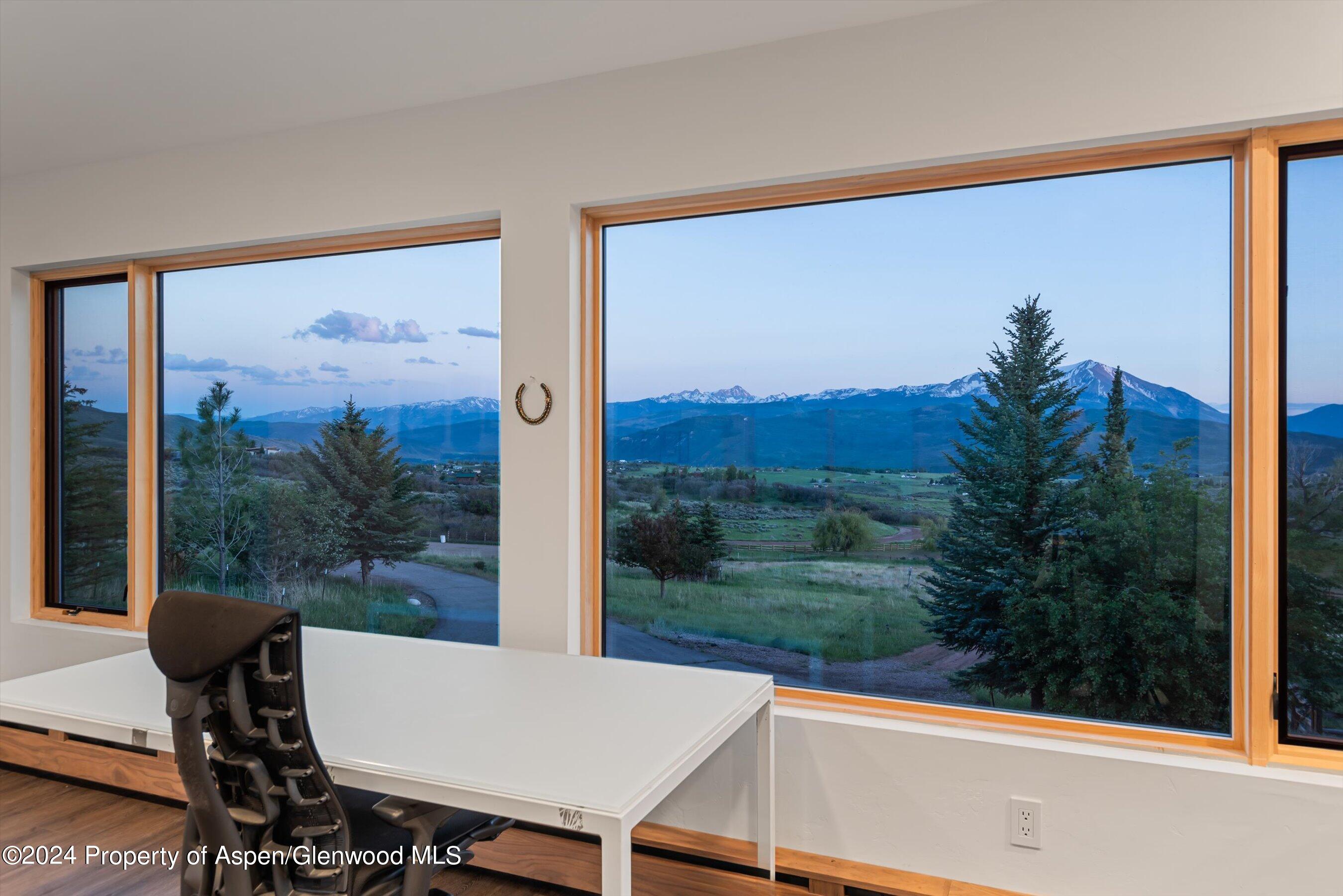 303 Park Meadows Lane Carbondale, CO 81623 - Photo 29 of 47 a view of a porch with furniture and yard