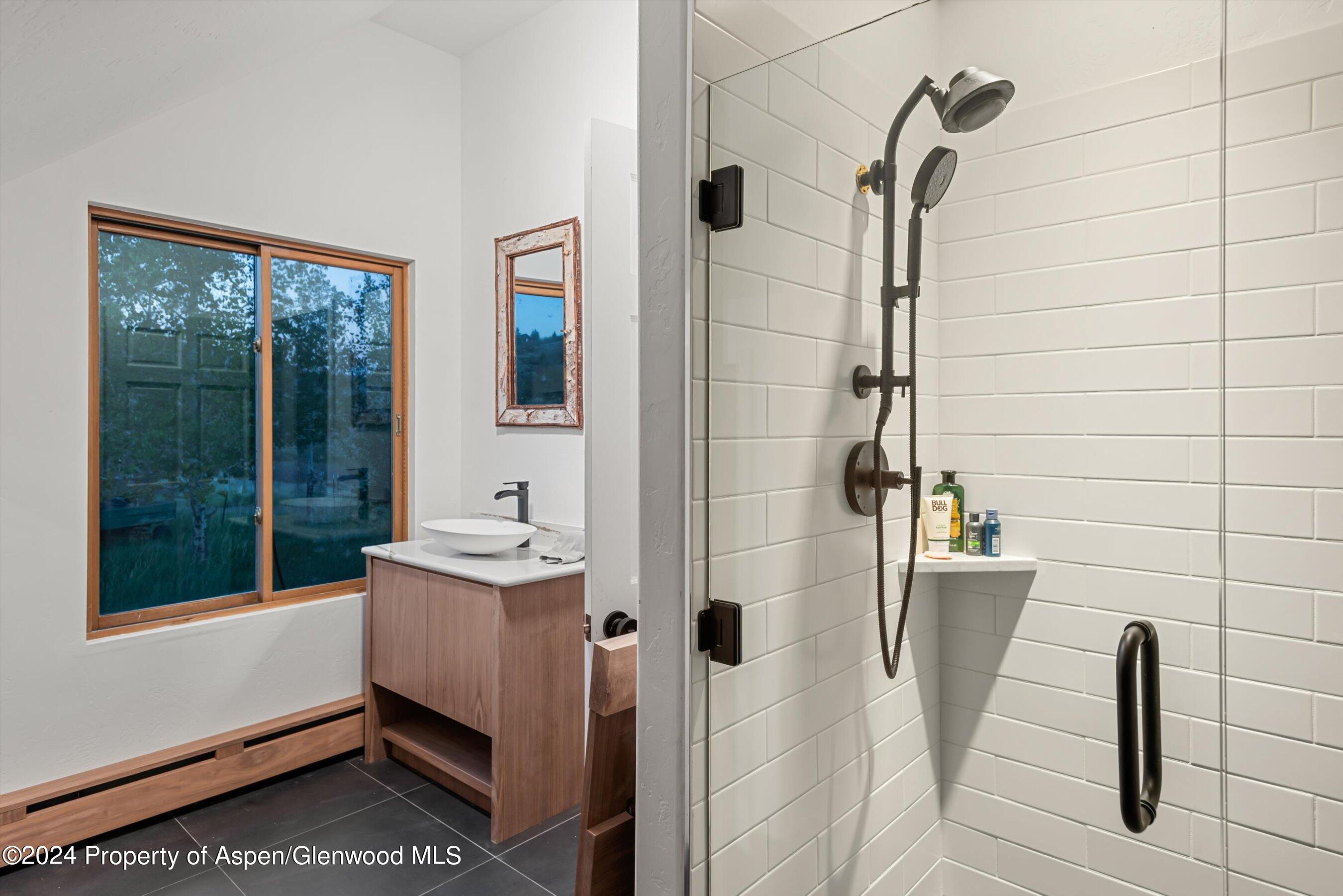 303 Park Meadows Lane Carbondale, CO 81623 - Photo 30 of 47 a bathroom with a sink a toilet and shower