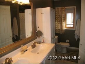 877 Bunker Hill Road Mount Solon, VA 22843 - Photo 17 of 22 a bathroom with a sink and a mirror
