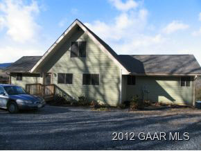 877 Bunker Hill Road Mount Solon, VA 22843 - Photo 3 of 22 a view of a house with a wooden fence