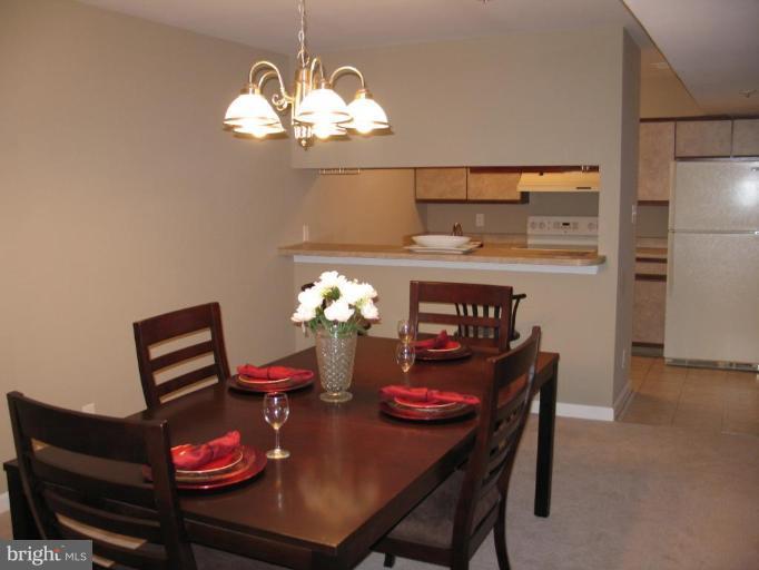 4932 Columbia Road, Unit 7 Columbia, MD 21044 - Photo 17 of 19 a view of a dining room with furniture