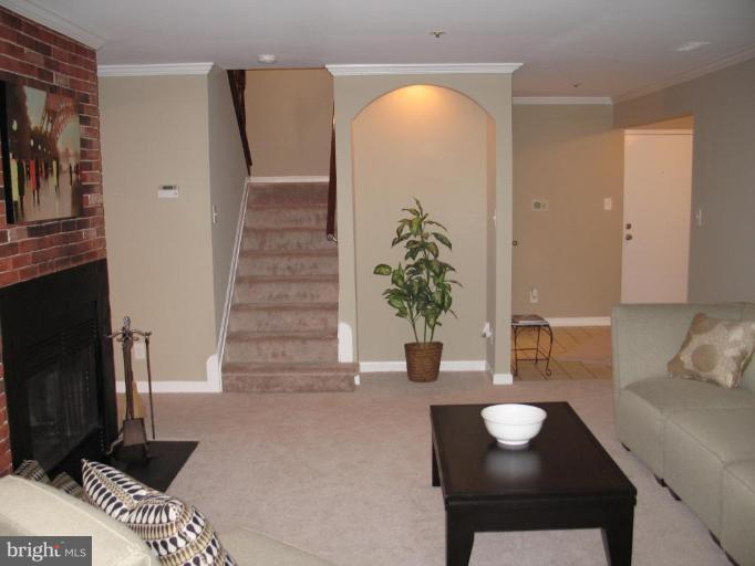 4932 Columbia Road, Unit 7 Columbia, MD 21044 - Photo 19 of 19 a view of a livingroom with furniture and entryway