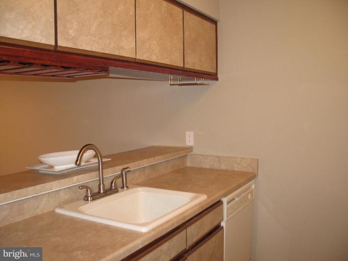 4932 Columbia Road, Unit 7 Columbia, MD 21044 - Photo 3 of 19 a bathroom with a sink and a mirror