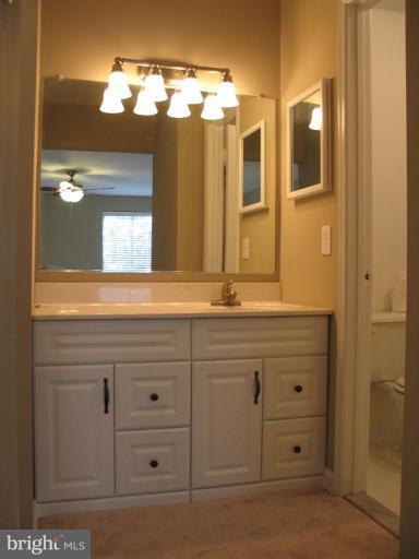 4932 Columbia Road, Unit 7 Columbia, MD 21044 - Photo 8 of 19 a bathroom with a double vanity sink and a mirror