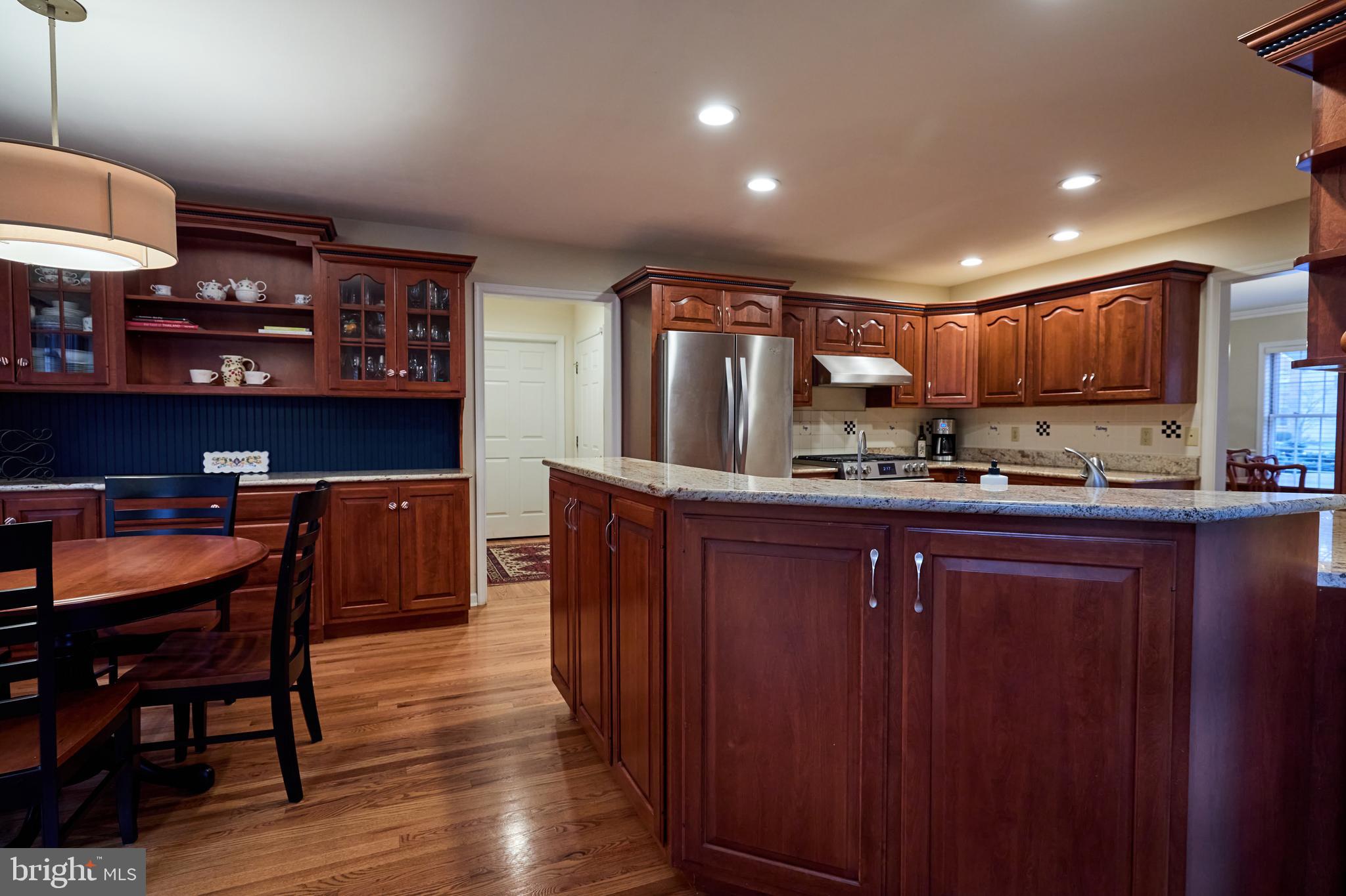 347 Buch Avenue Lancaster, PA 17601 - Photo 11 of 50 a kitchen with cabinets a counter and chairs