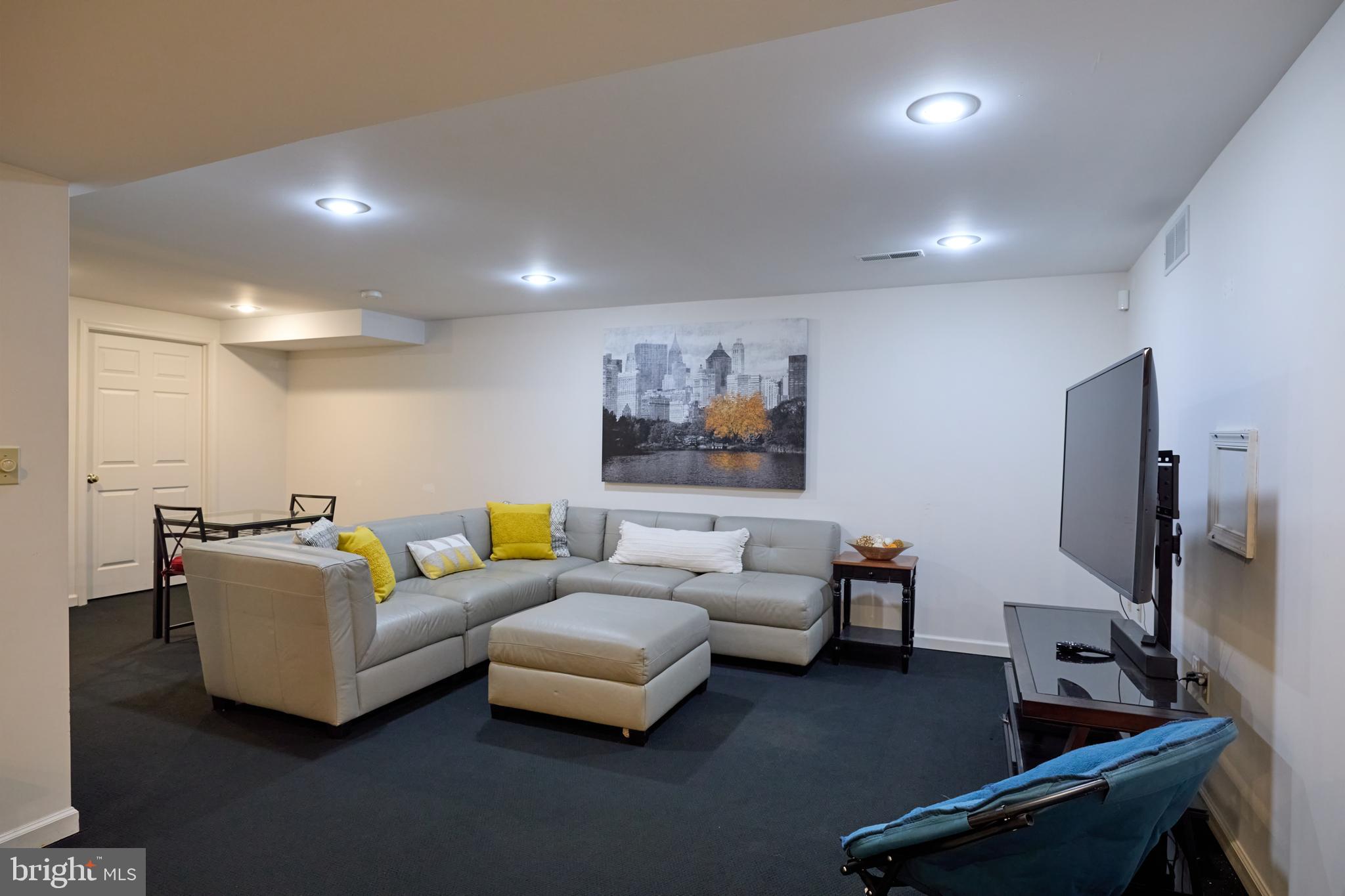 347 Buch Avenue Lancaster, PA 17601 - Photo 34 of 50 a living room with furniture and a flat screen tv