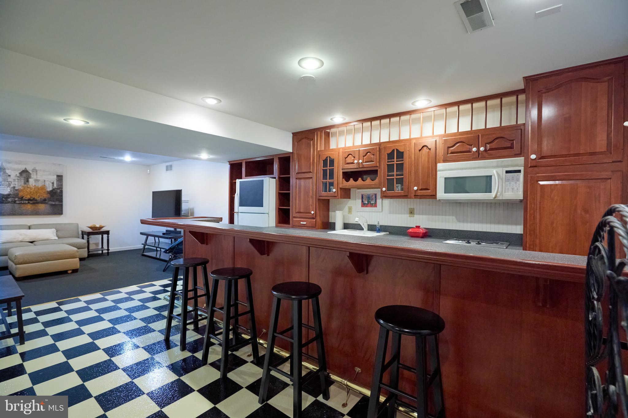 347 Buch Avenue Lancaster, PA 17601 - Photo 36 of 50 a kitchen with stainless steel appliances granite countertop a sink and a refrigerator