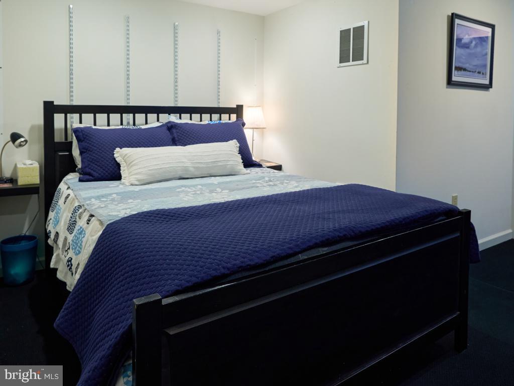 347 Buch Avenue Lancaster, PA 17601 - Photo 38 of 50 a bedroom with a bed and a lamp on dresser