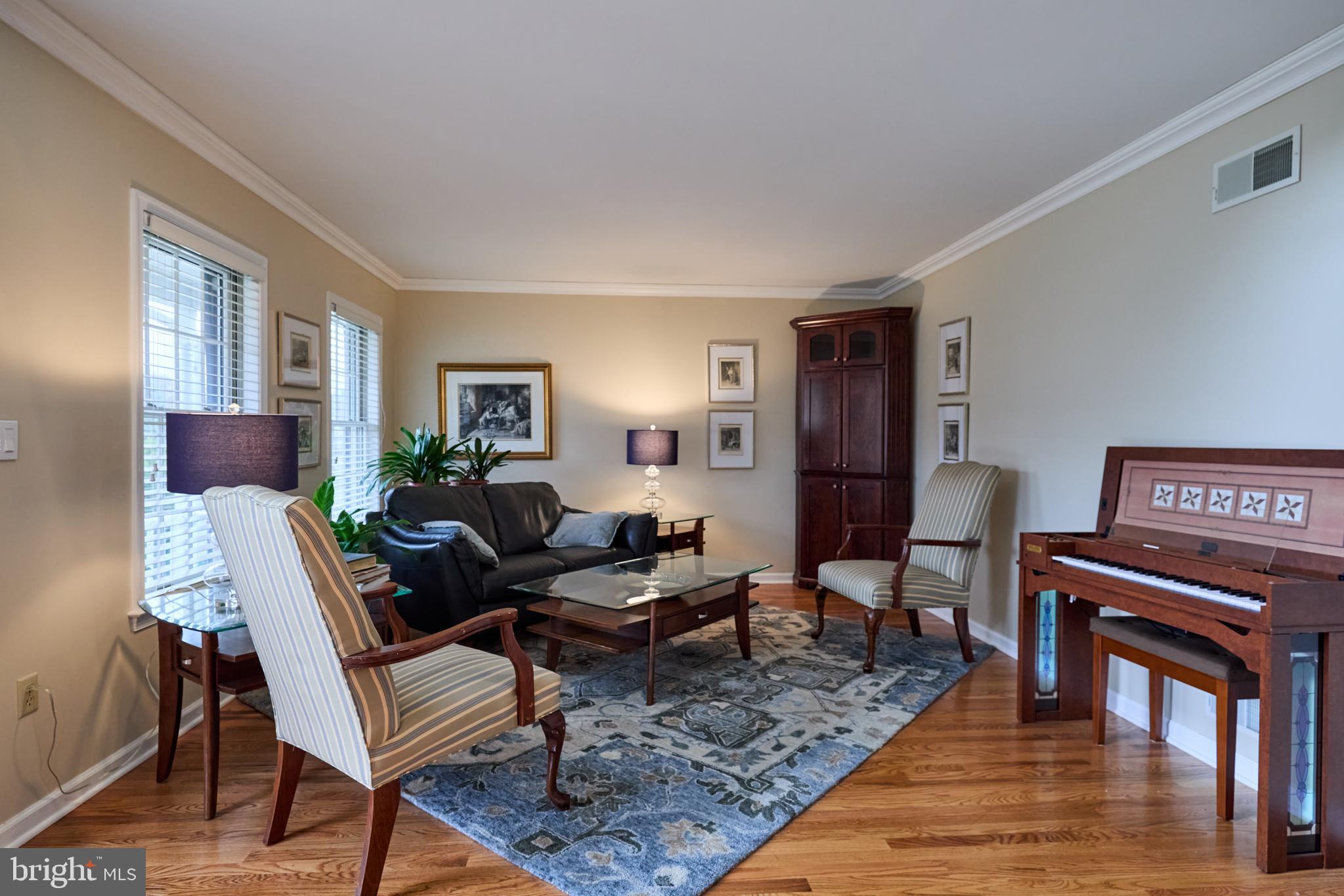 347 Buch Avenue Lancaster, PA 17601 - Photo 5 of 50 a living room with furniture a piano and a bookshelf