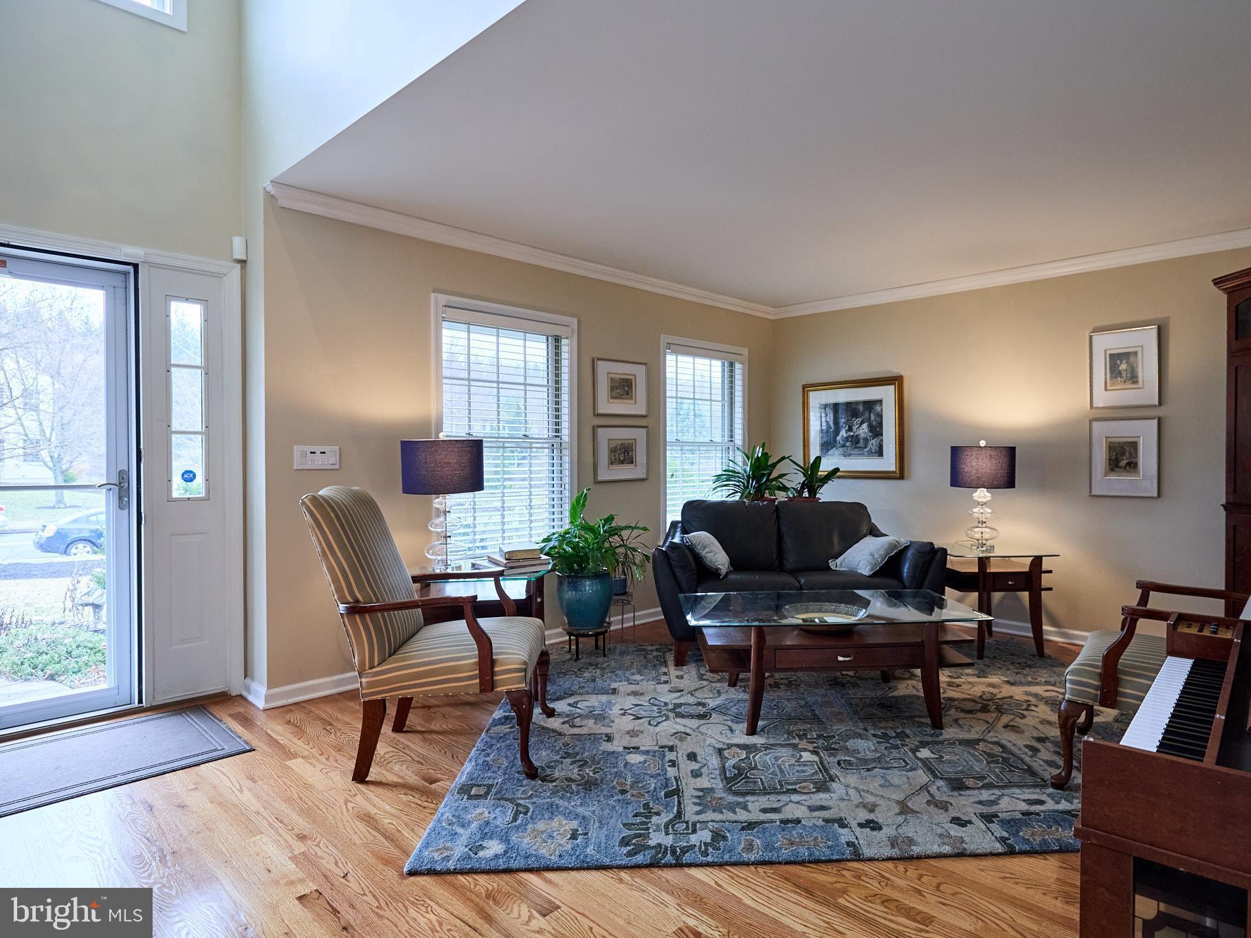 347 Buch Avenue Lancaster, PA 17601 - Photo 6 of 50 a living room with furniture a rug a lamp and windows