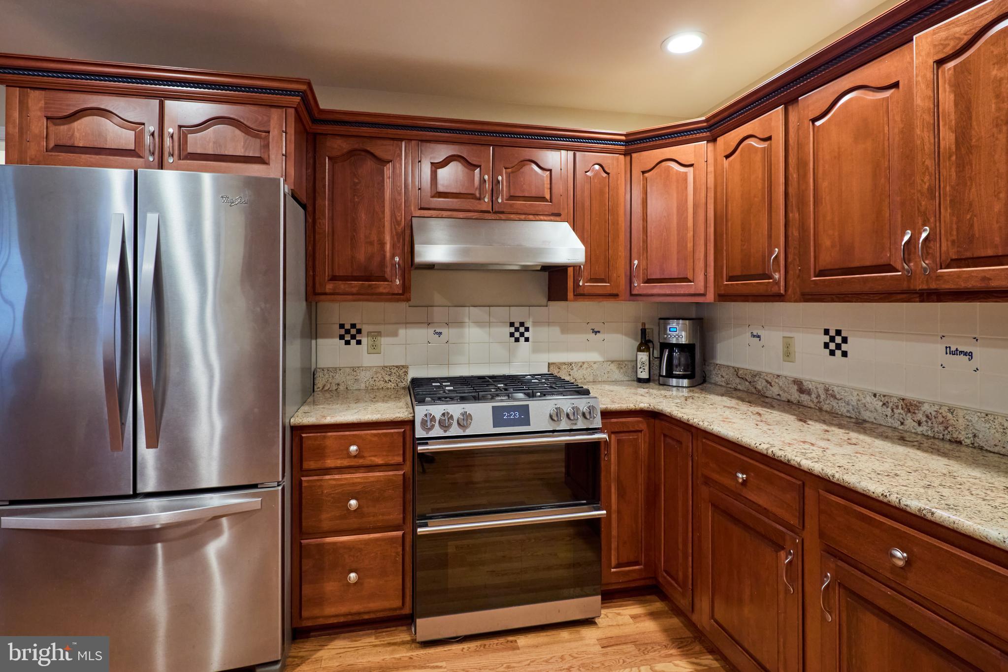 347 Buch Avenue Lancaster, PA 17601 - Photo 9 of 50 a kitchen with stainless steel appliances granite countertop a refrigerator stove and sink