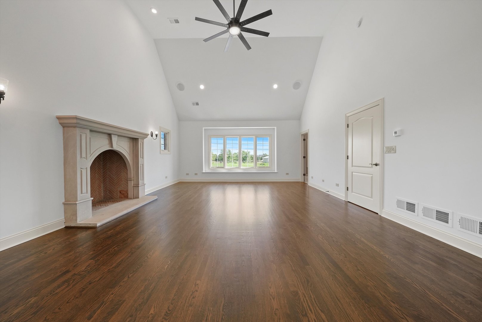 12539 West Baker Road Manhattan, IL 60442 - Photo 54 of 129 a view of an empty room with wooden floor and a window