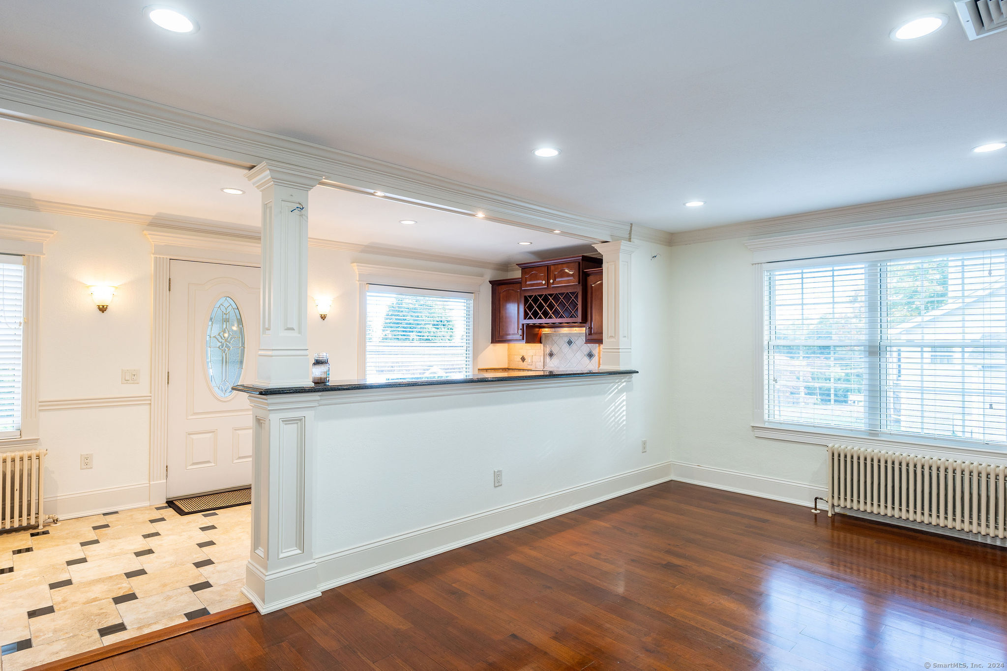 231 Buckingham Street Watertown, CT 06779 - Photo 15 of 30 a kitchen with stainless steel appliances wooden floor and window