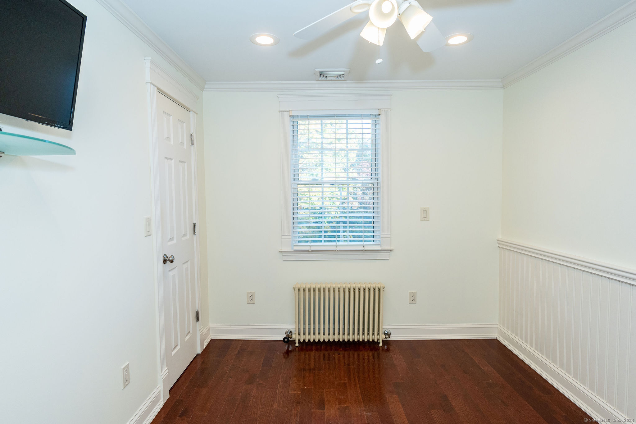 231 Buckingham Street Watertown, CT 06779 - Photo 21 of 30 an empty room with a window and wooden floor