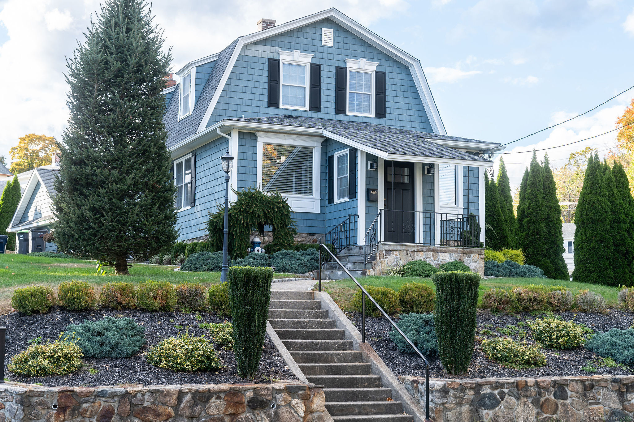 231 Buckingham Street Watertown, CT 06779 - Photo 7 of 30 a front view of a house with garden