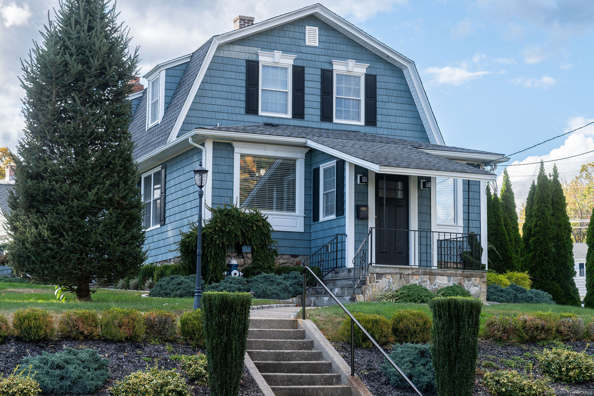 231 Buckingham Street Watertown, CT 06779 - Photo 8 of 30 a front view of a house with garden