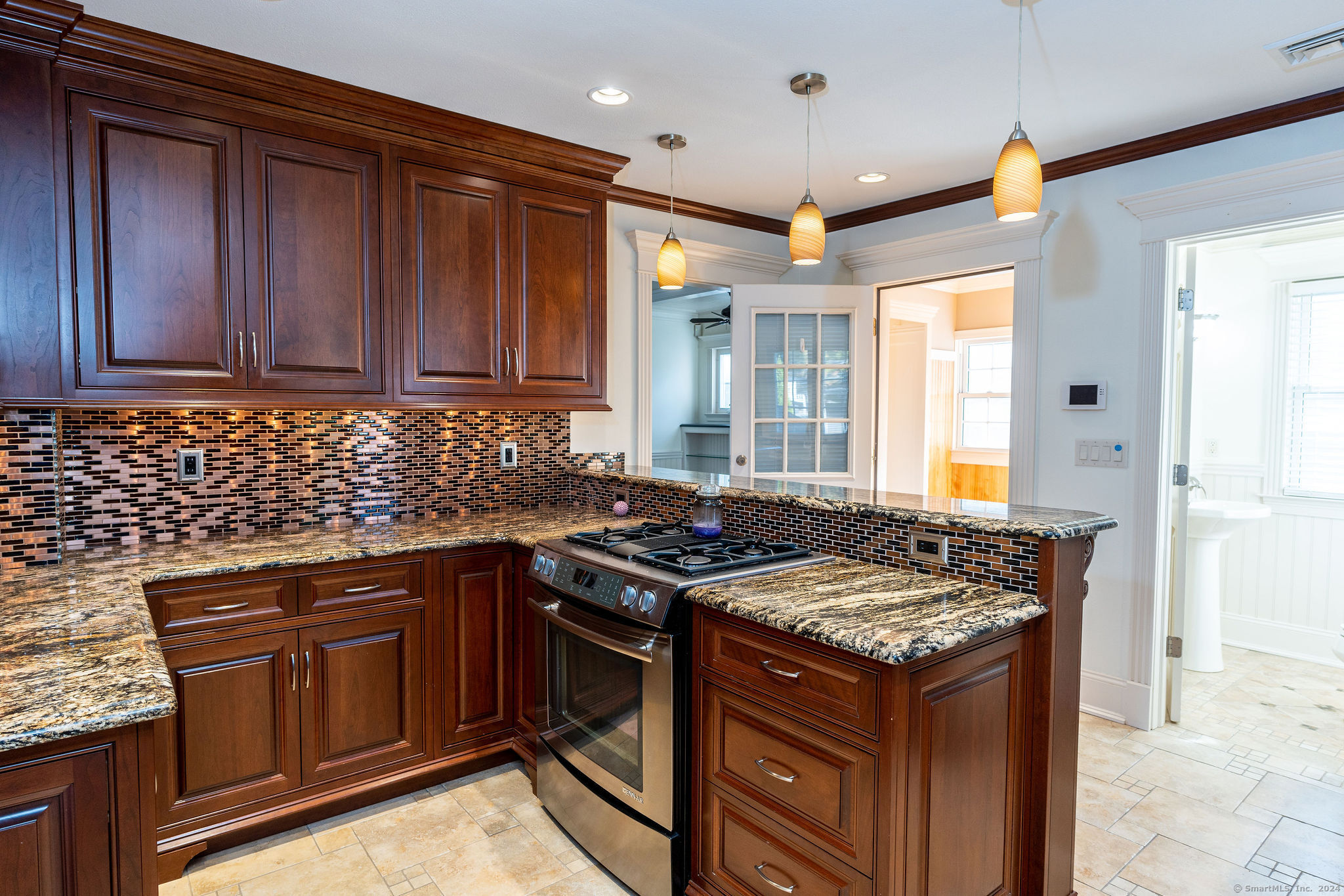 231 Buckingham Street Watertown, CT 06779 - Photo 10 of 30 a kitchen with a stove and a sink