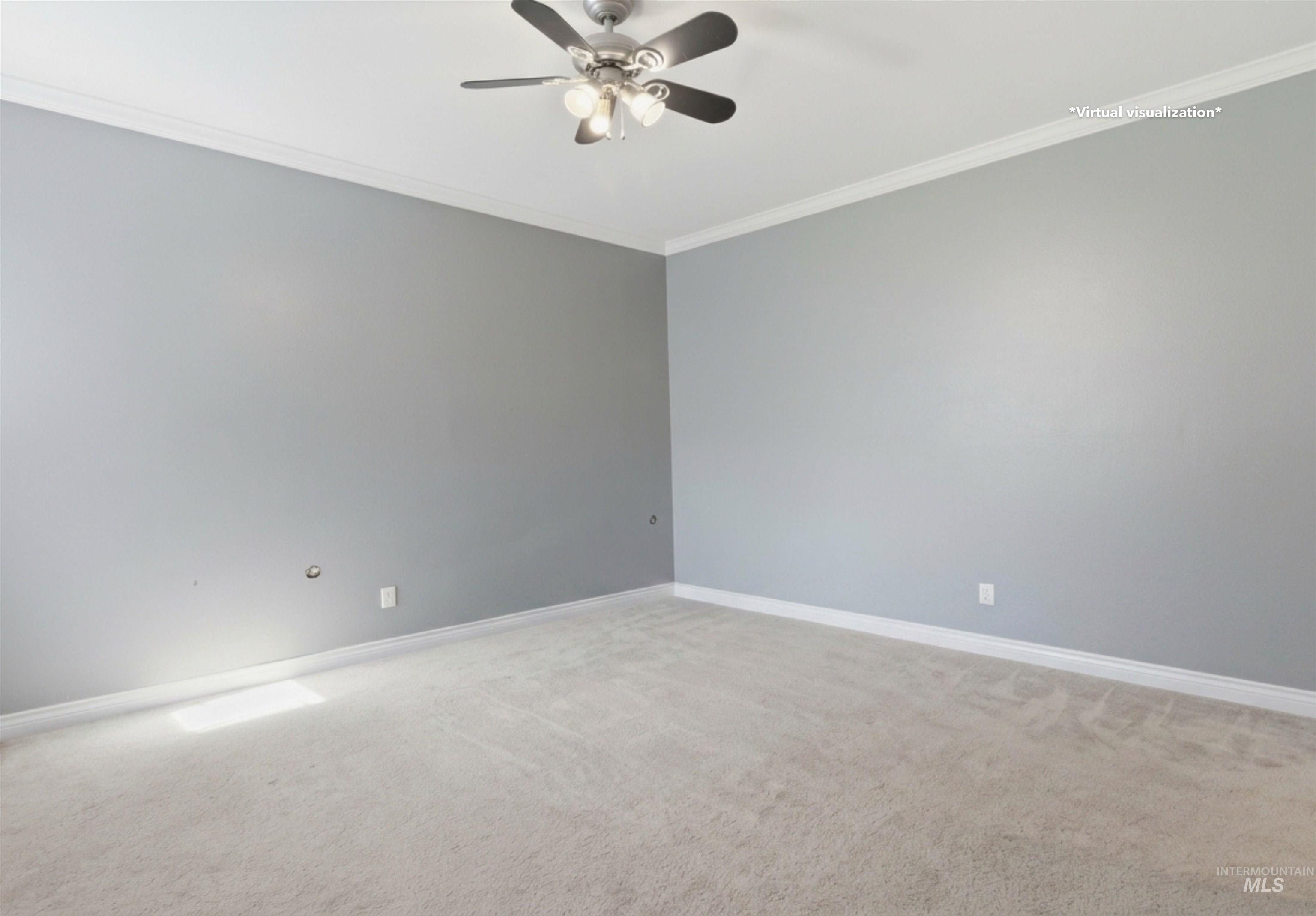 1540 Pine Cone Road Moscow, ID 83843 - Photo 35 of 49 Spacious room featuring neutral carpeting, light gray wall paint, white crown molding, and a ceiling fan with integrated lighting
