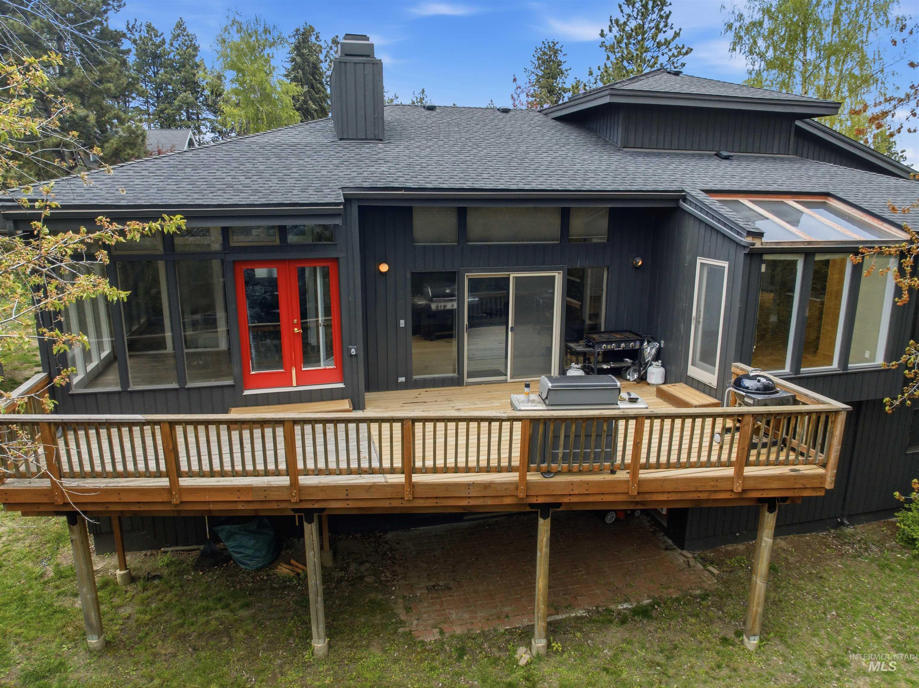 1540 Pine Cone Road Moscow, ID 83843 - Photo 39 of 49 Expansive rear deck featuring wood railings and support posts