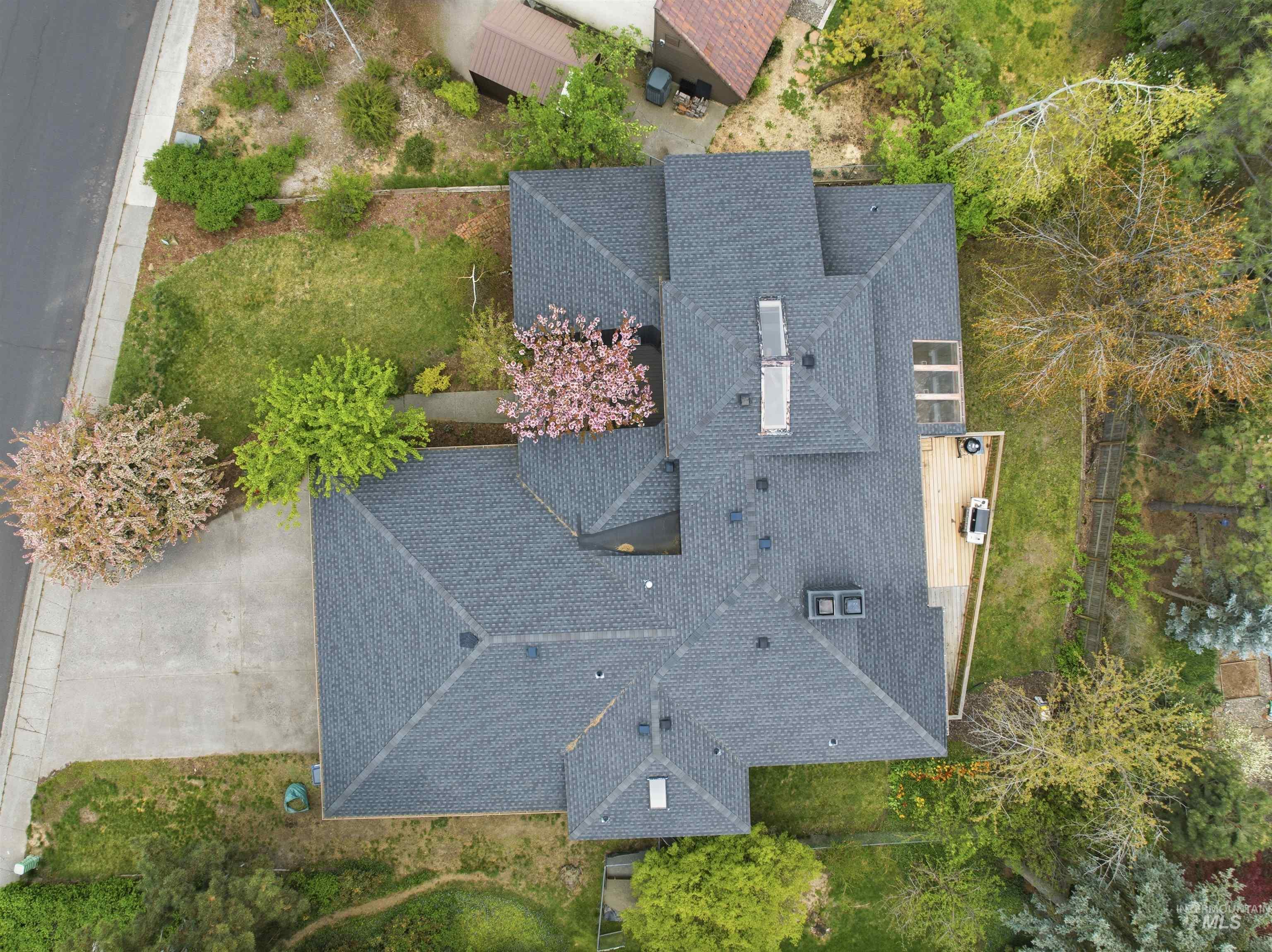 1540 Pine Cone Road Moscow, ID 83843 - Photo 49 of 49 Expansive roofline featuring dark shingles, multiple gables, and a skylight array