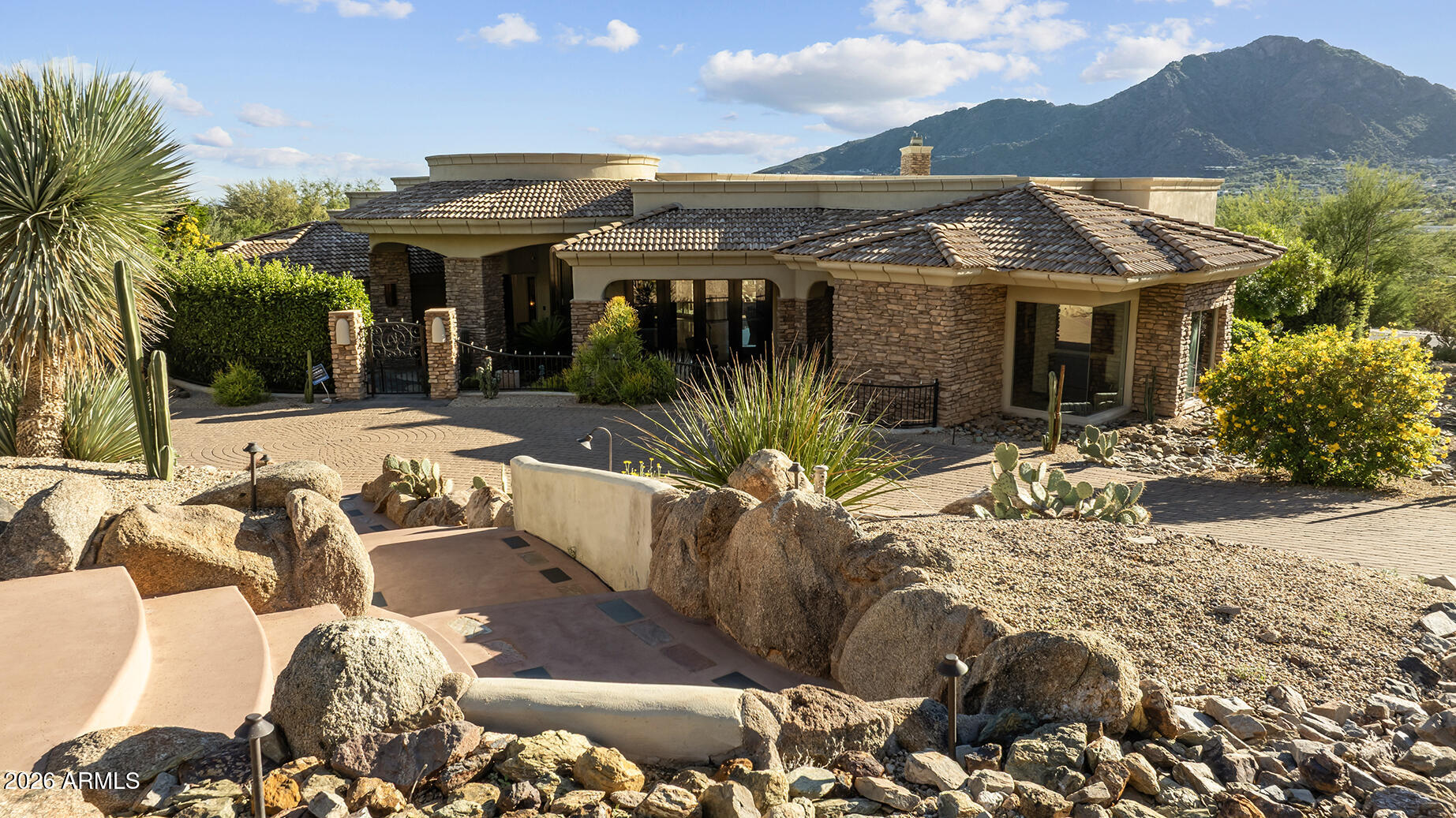 6207 East Indian Bend Road Paradise Valley, AZ 85253 - Photo 2 of 42 a view of a house with backyard