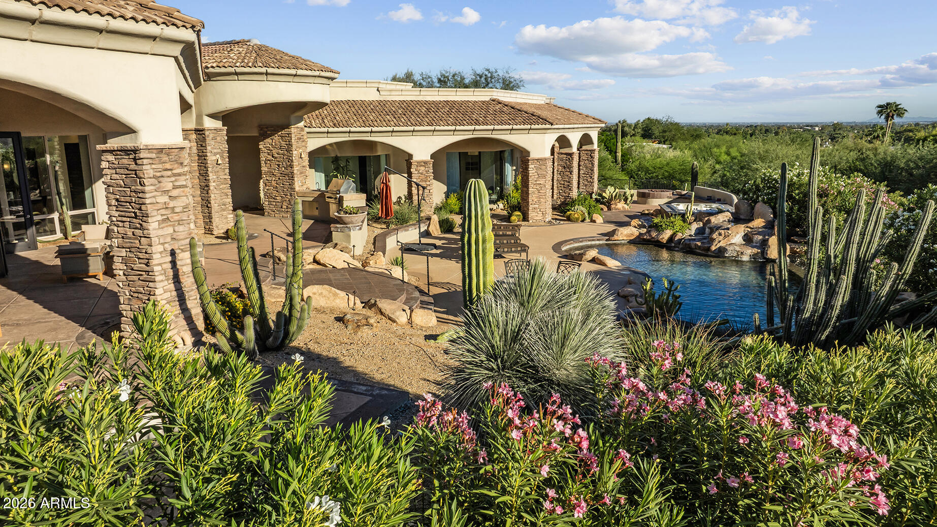 6207 East Indian Bend Road Paradise Valley, AZ 85253 - Photo 3 of 42 a view of multiple house with outdoor space and seating
