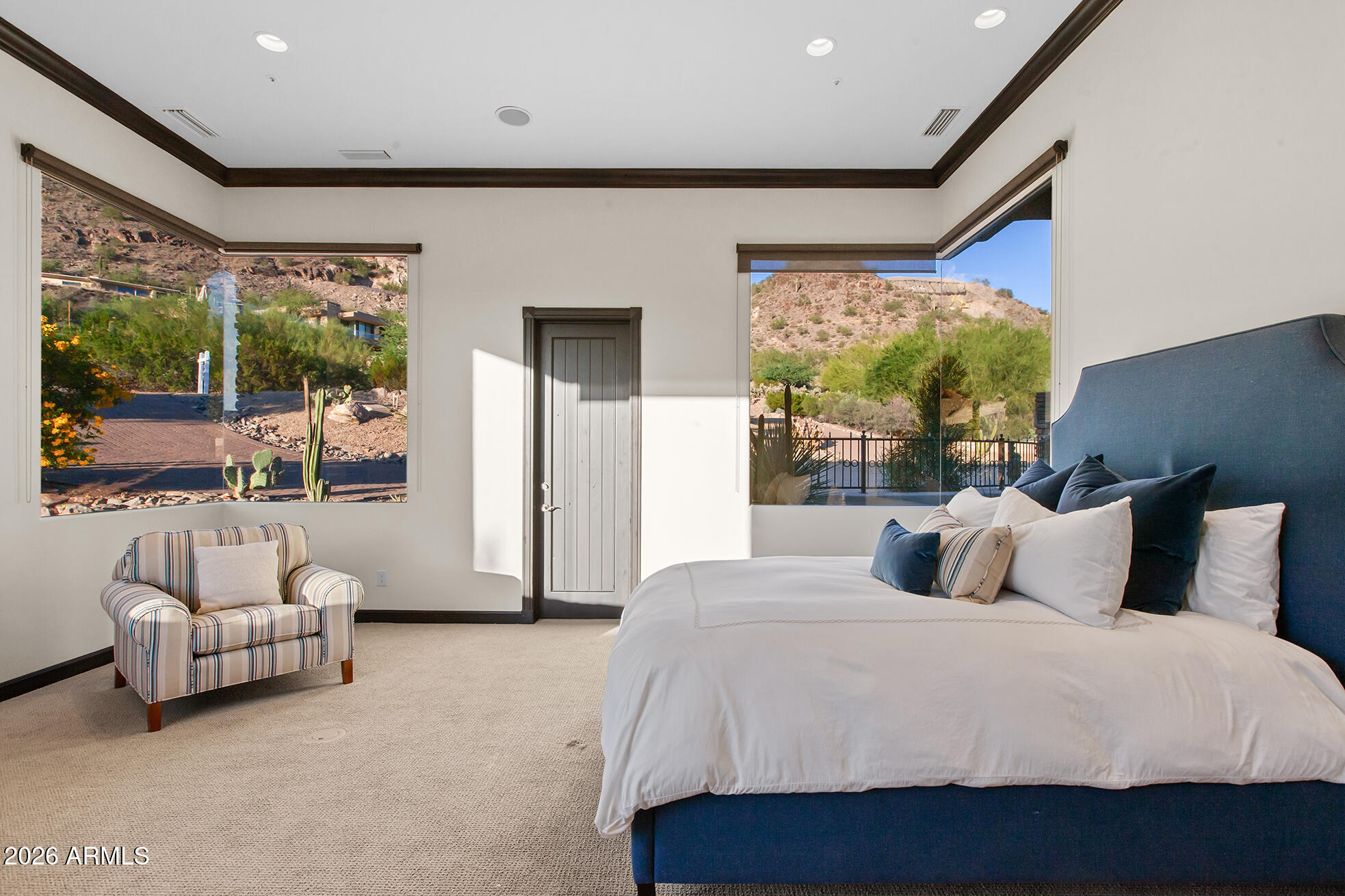 6207 East Indian Bend Road Paradise Valley, AZ 85253 - Photo 34 of 42 a bedroom with a bed and a large window