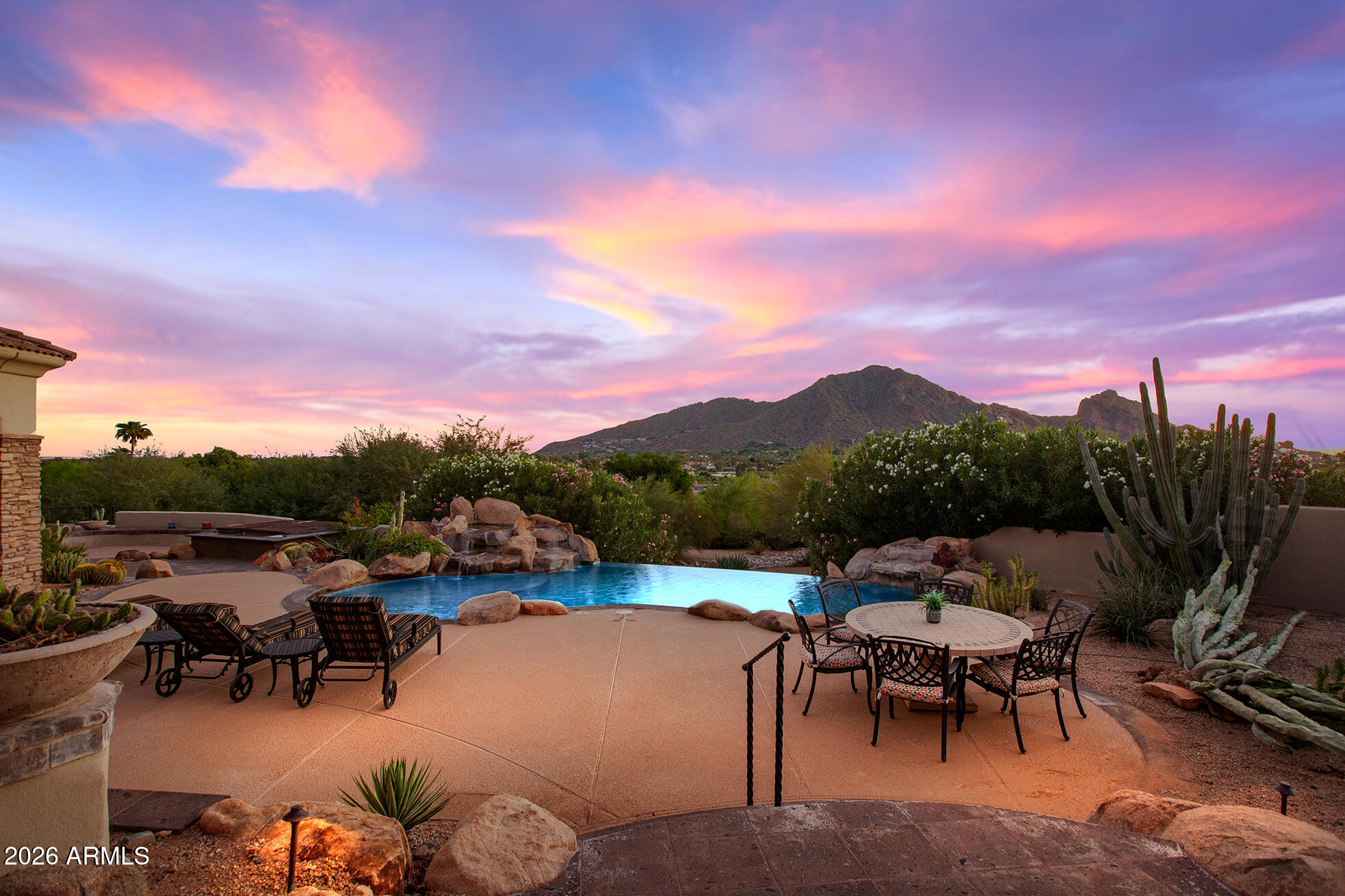 6207 East Indian Bend Road Paradise Valley, AZ 85253 - Photo 4 of 42 a view of a terrace with furniture and a garden