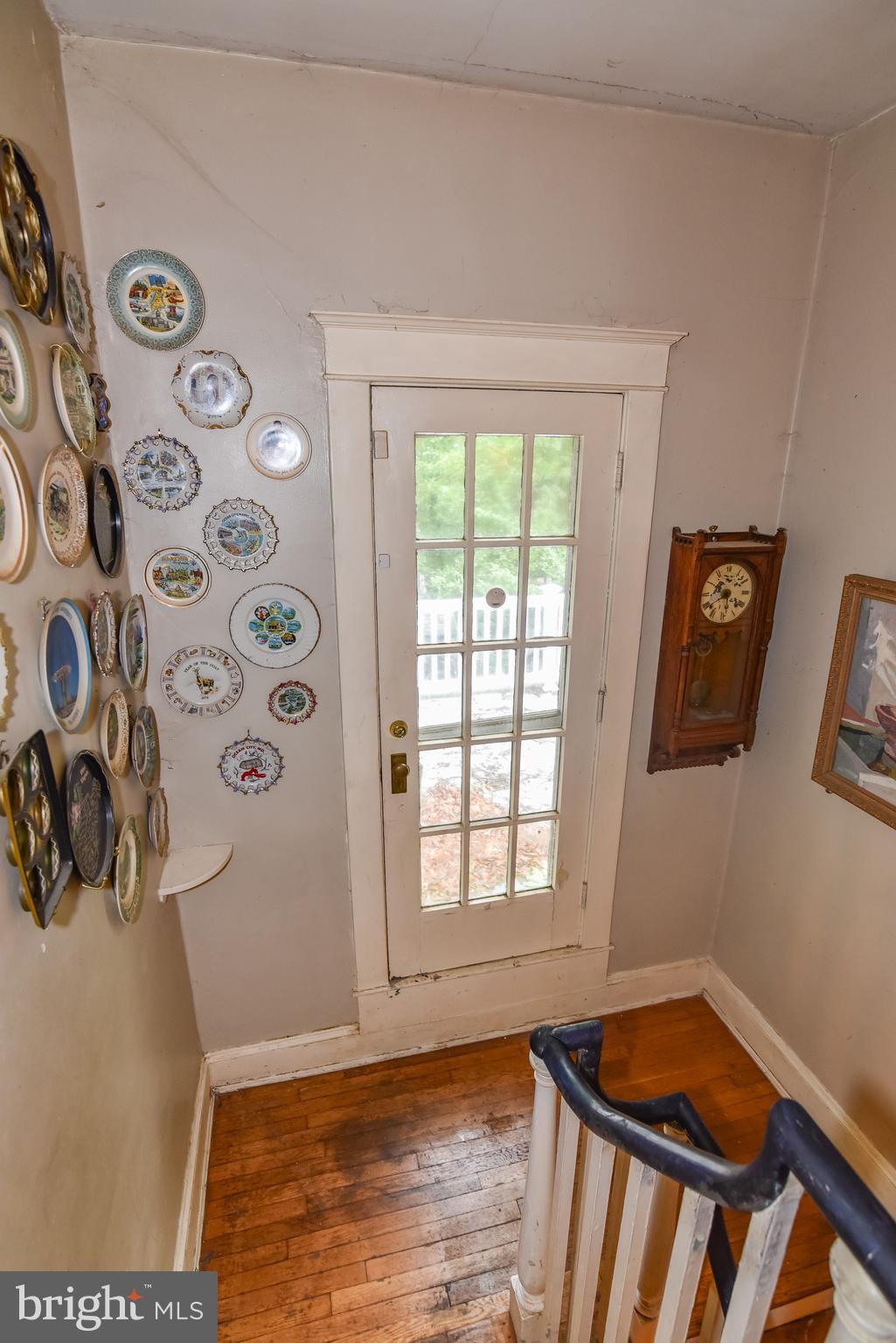 24 Merrymount Road Baltimore, MD 21210 - Photo 21 of 48 a view of an empty room with window and hardwood floor
